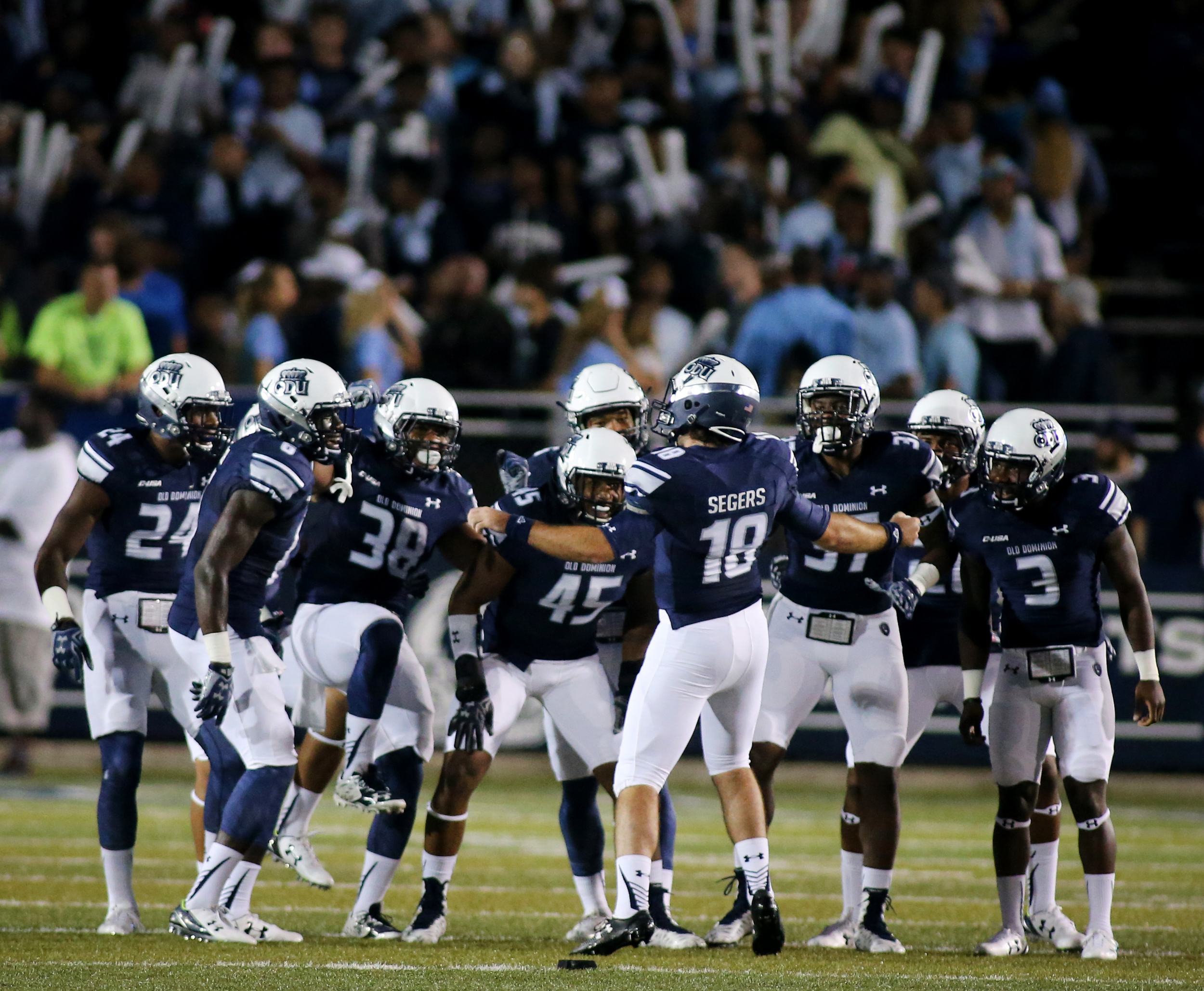 Old Dominion kicker Ricky Segers (18) gets the defense pumped up before the opening kickoff against Norfolk State, Saturday, Sept. 12, 2015 at Foreman Field in Norfolk. 