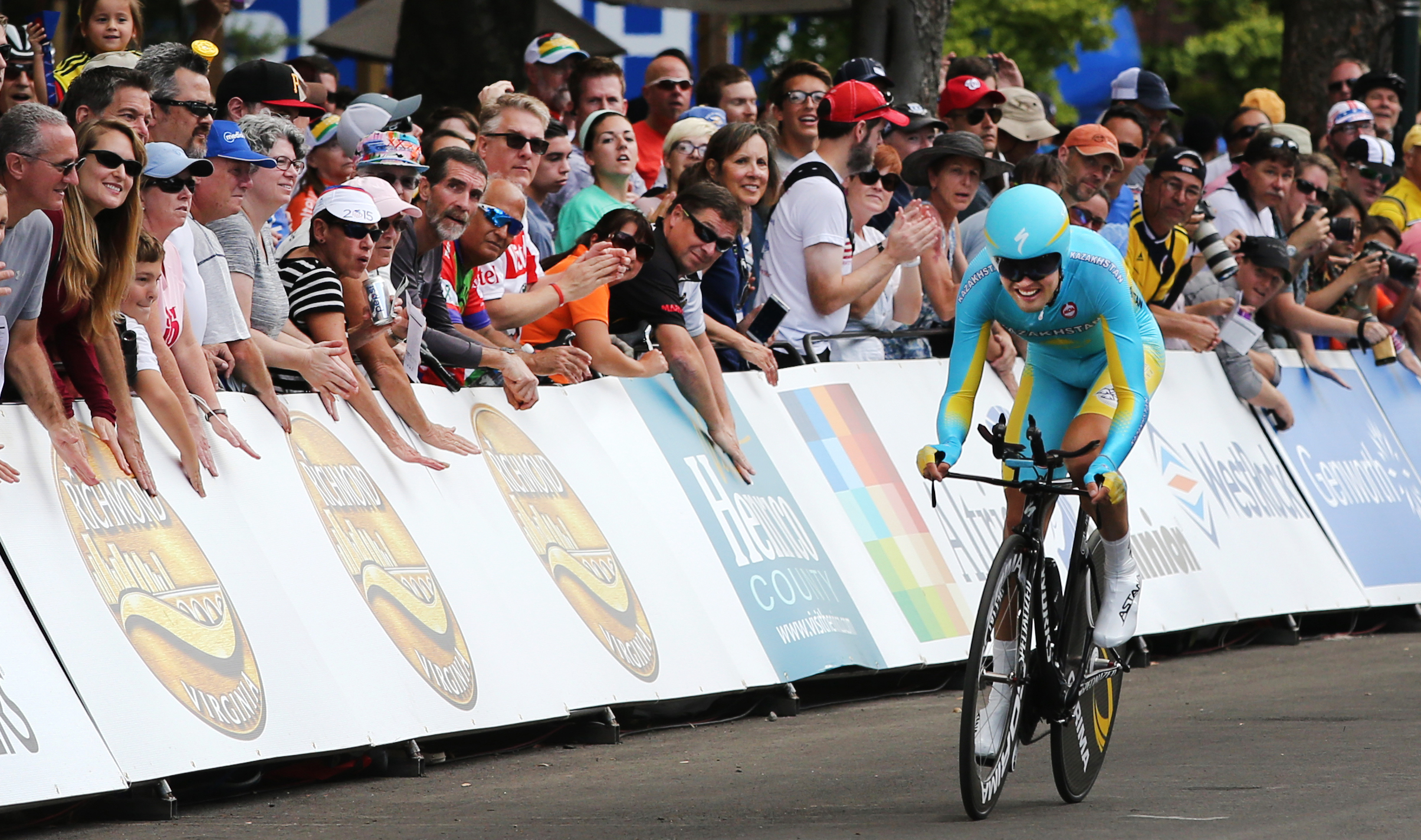 Daniil Fominykh, of Kazakhstan, crosses the finish line during the men's elite time trial at the UCI Road World Championships cycling races in Richmond, Va., Wednesday, Sept. 23, 2015. (AP Photo/Jason Hirschfeld)