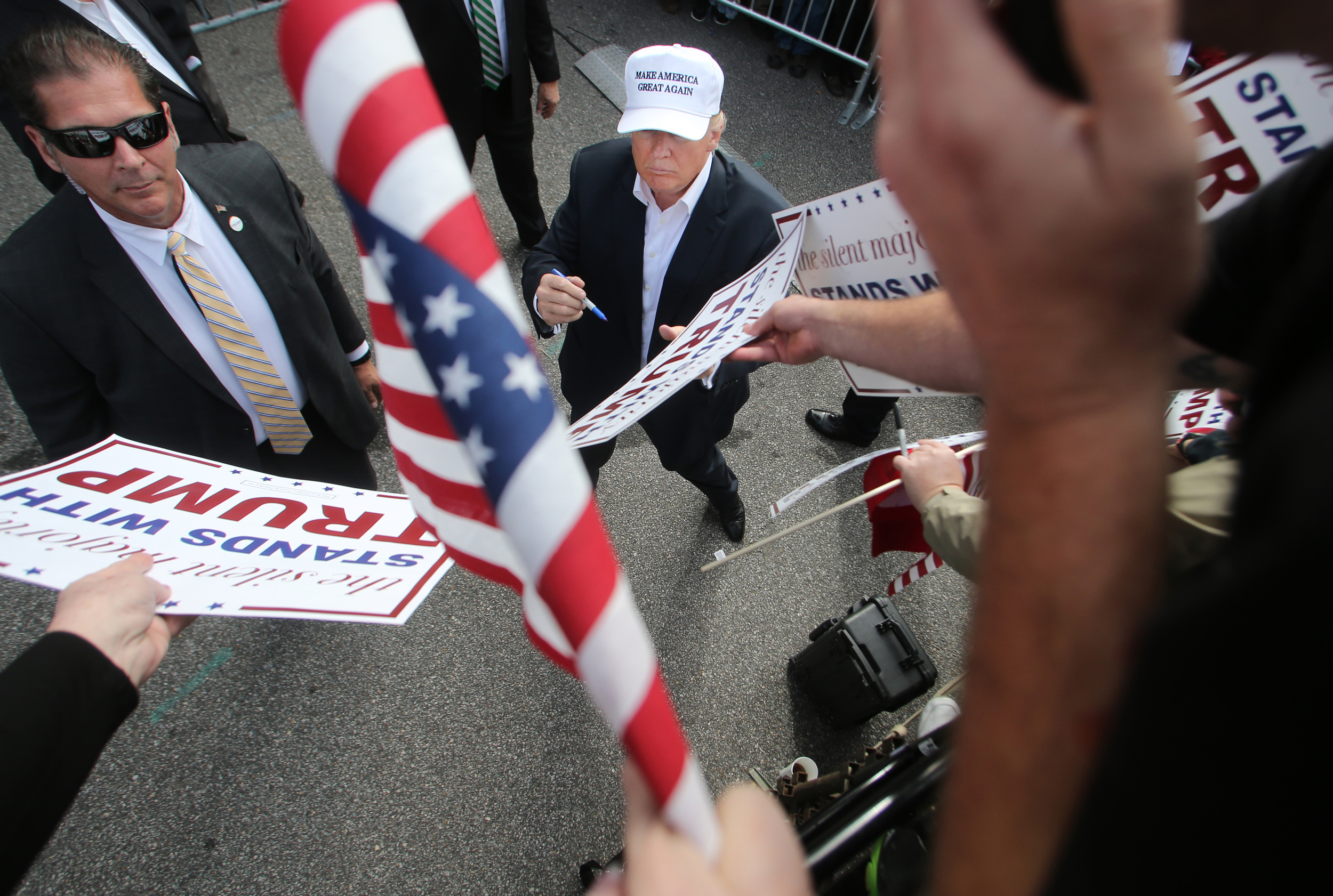 Republican presidential candidate Donald Trump signs autographs for supporters during a rally, Saturday, Oct. 31, 2015 in Norfolk, Va. (AP Photo/Jason Hirschfeld)
