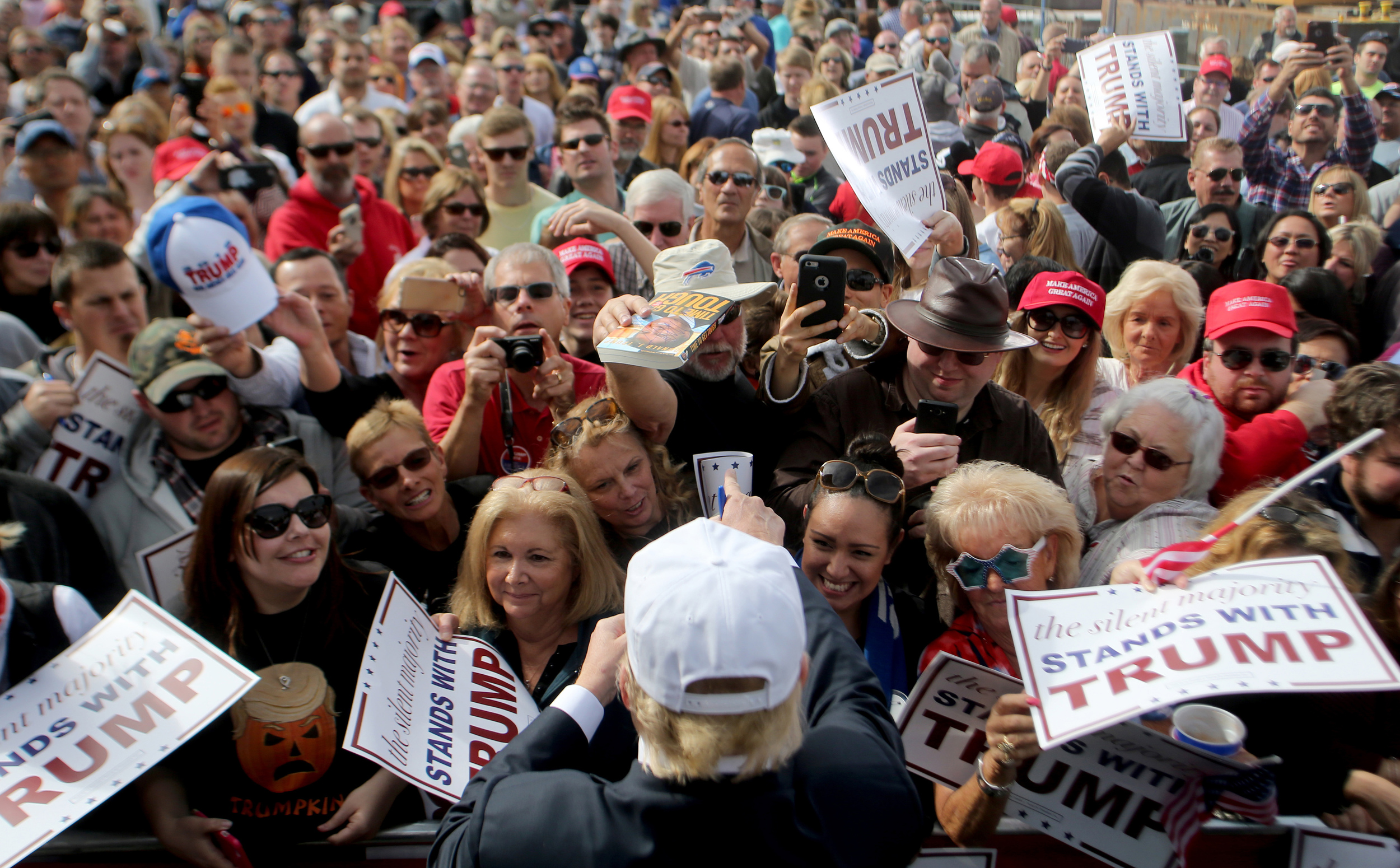 Republican presidential candidate Donald Trump signs autographs for supporters during a rally, Saturday, Oct. 31, 2015 in Norfolk, Va. (AP Photo/Jason Hirschfeld)