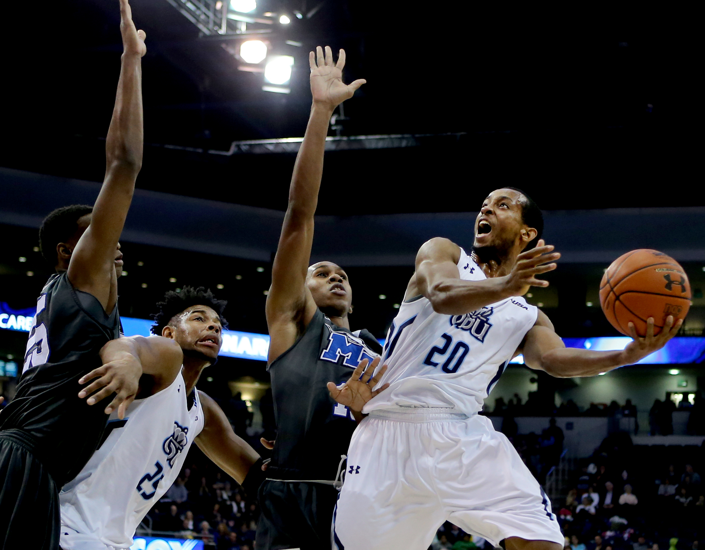 Old Dominion's Trey Freeman, right, shoots over Middle Tennessee's Jaqawn Raymond for two of his game-high 28 points in ODU's 64-61 loss, Saturday, Jan. 16, 2016 at the Constant Center in Norfolk. (Jason Hirschfeld | For The Virginian-Pilot)