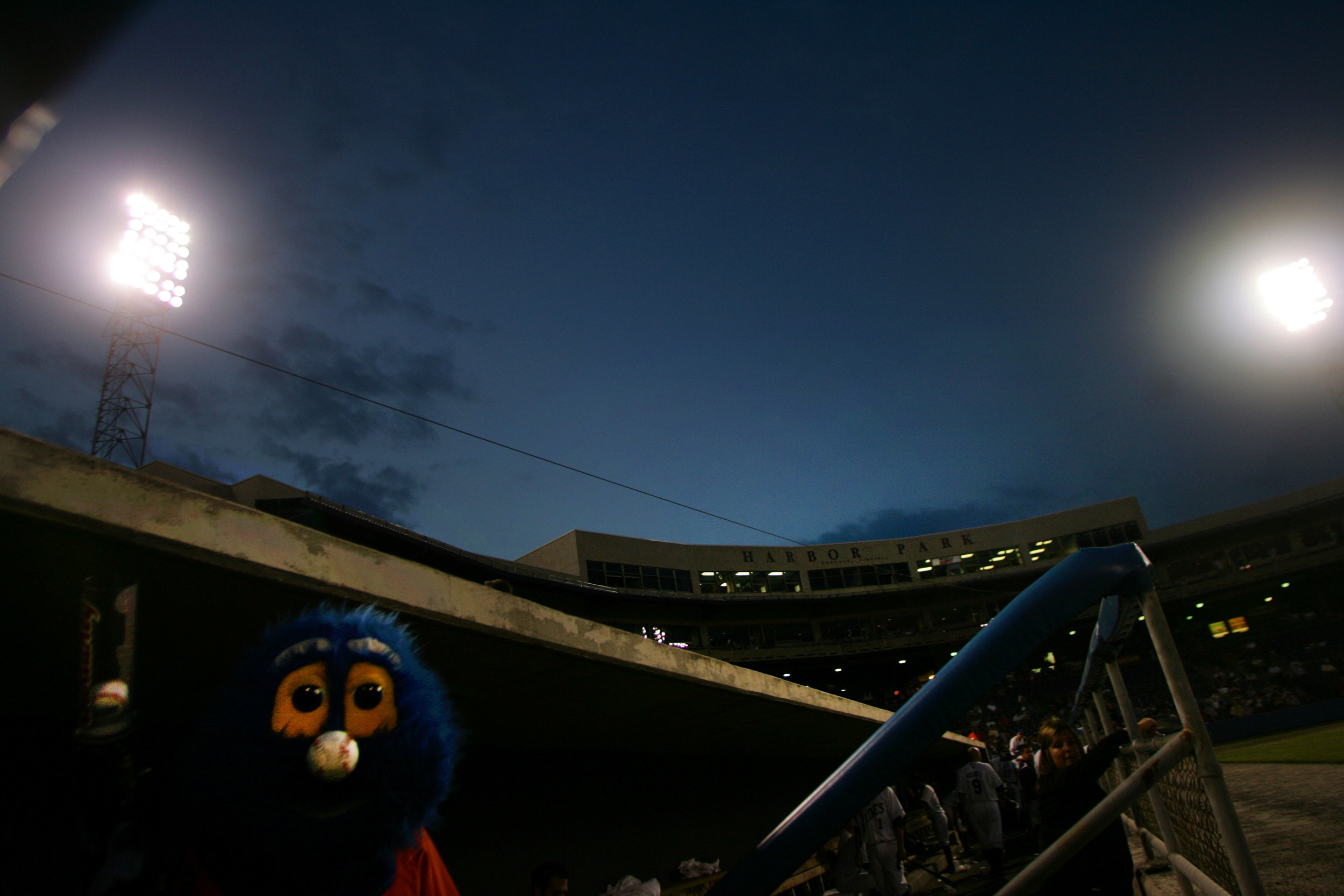 Rip Tide, mascot for the Triple-A Norfolk Tides , stands in the dugout before taking the field to entertain the crowd in a game against Rochester.