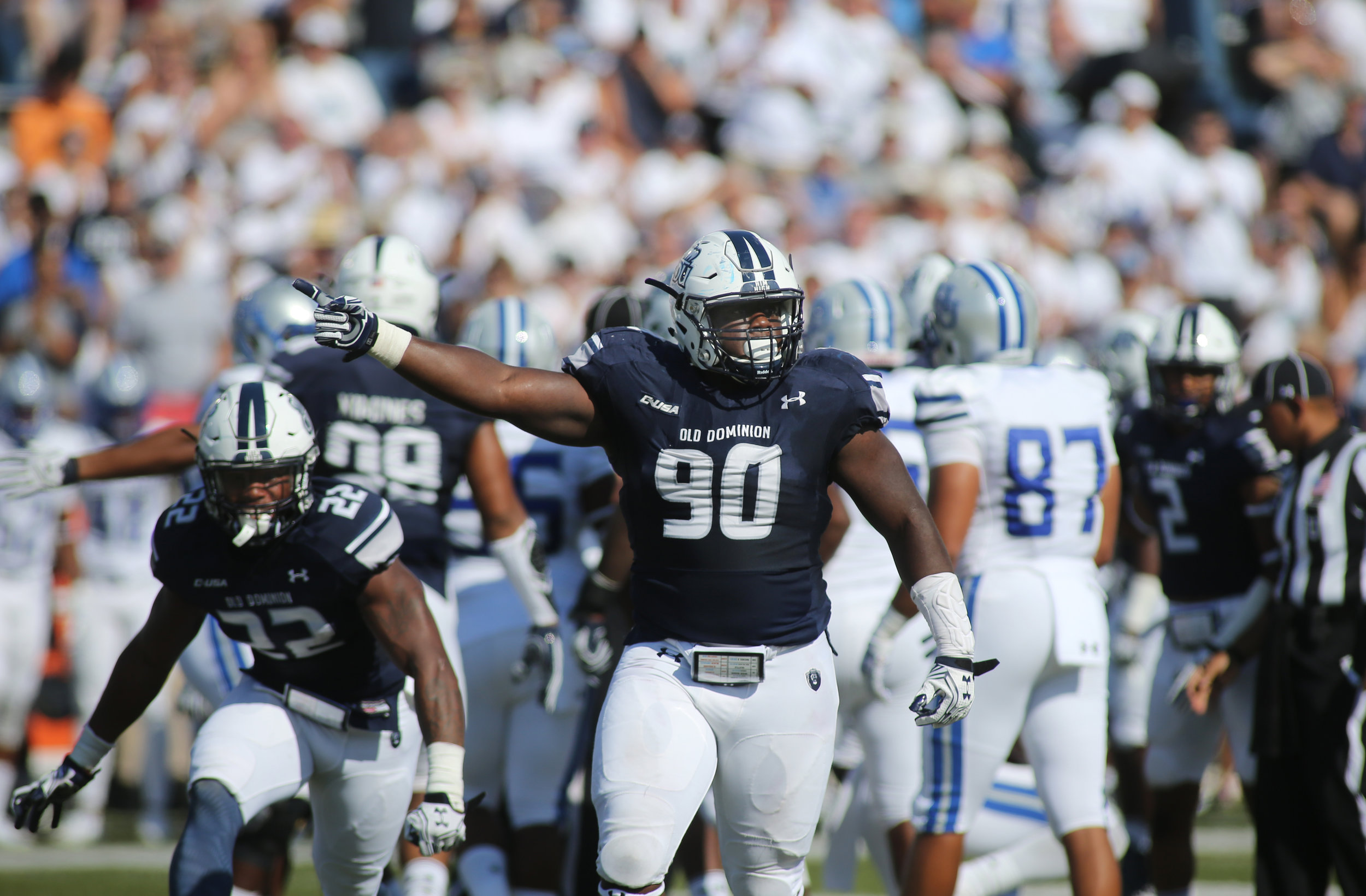 Old Dominion's Miles Fox, center, celebrates a three-and-out forcing Hampton to punt in the second quarter, Sunday, Sept. 4, 2016 at Foreman Field in Norfolk. (Jason Hirschfeld | The Virginian-Pilot)