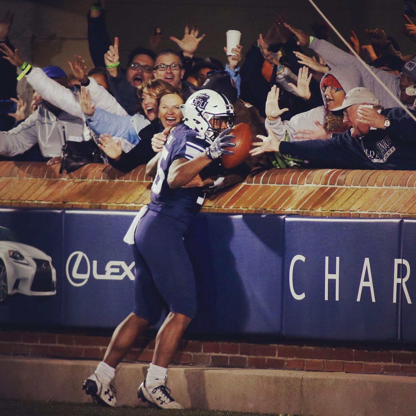 Old Dominion's Jeremy Cox celebrates his touchdown with fans that would seal their 51-35 win over Southern Mississippi, Saturday, Nov. 12, 2016 at Foreman Field in Norfolk.