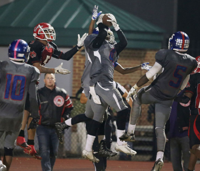 Norview's Kavon Lawson hauls in a last second heave by Hampton as time expired during their 37-31 5A South Region semifinal win, Friday, Nov. 25, 2016 at Darling Stadium in Hampton.
