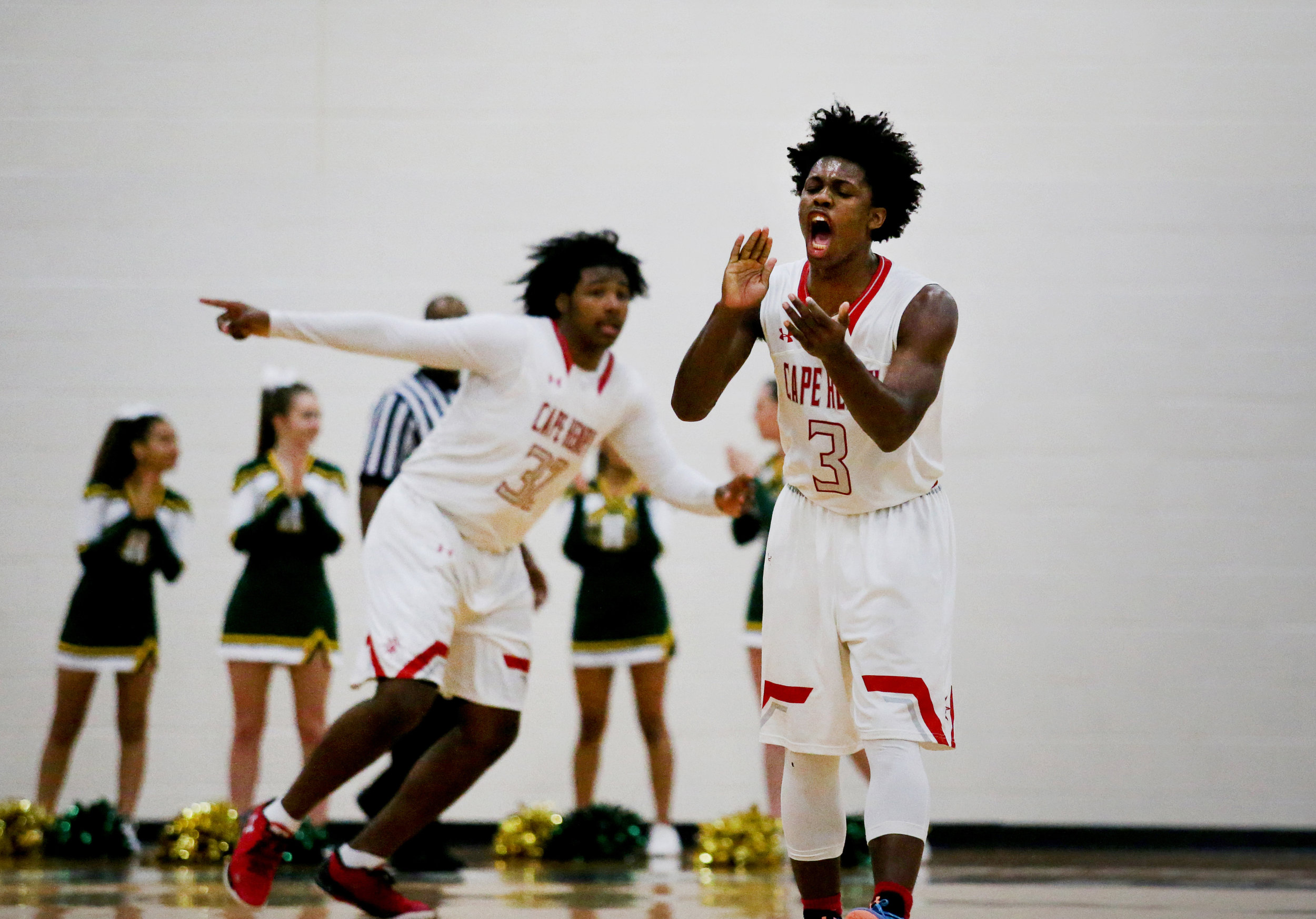 Cape Henry's Iziah James cheers towards the Dolphins student section in the closing minutes of their 83-67 win over Bishop Sullivan to claim the TCIS championship, Saturday, Feb. 26, 2017 at Hampton Roads Academy in Newport News. (Jason Hirschfeld | The Virginian-Pilot)