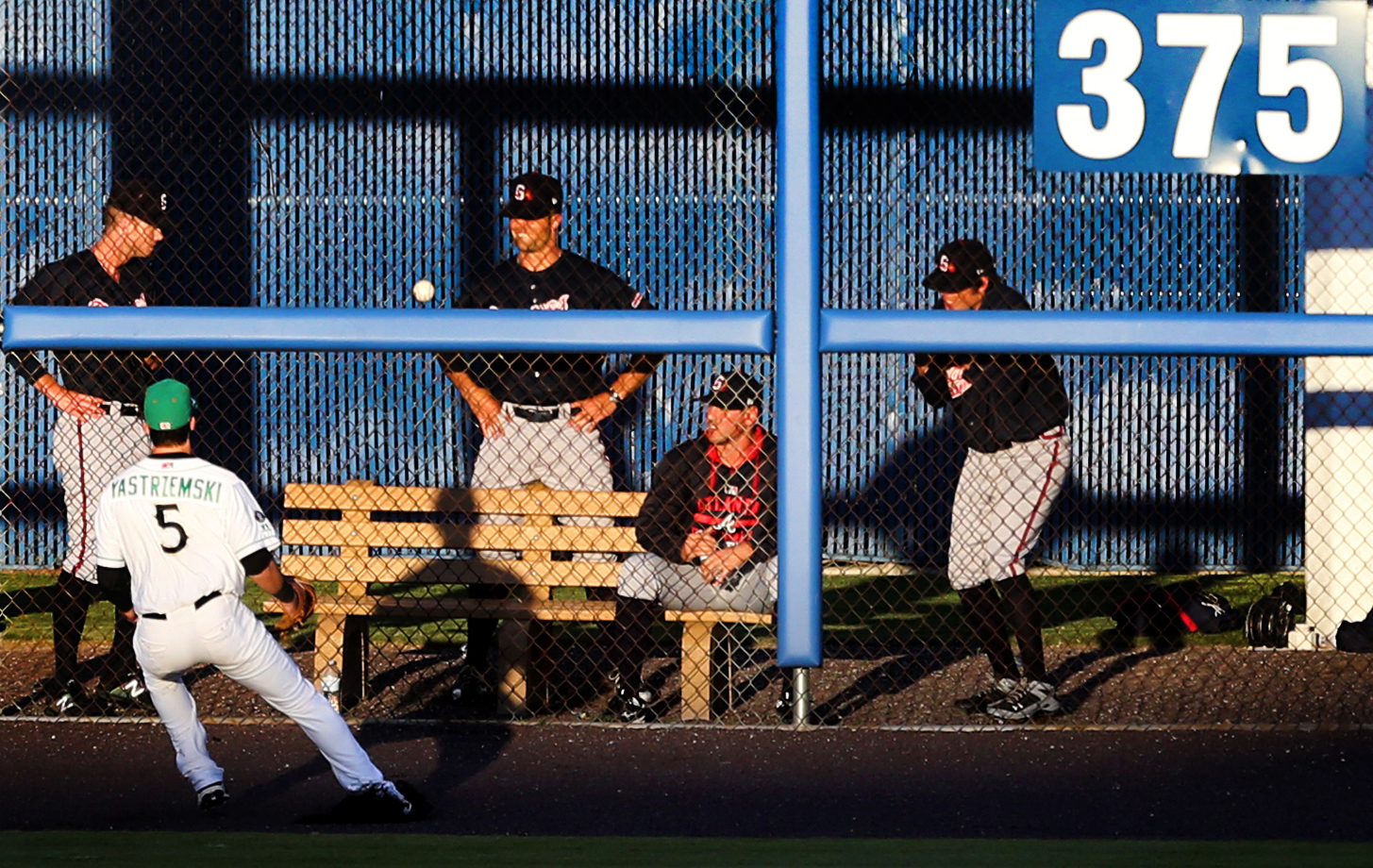 Tides left fielder Mike Yastrzemski plays a fourth-inning double off the wall from Gwinnett's Rio Ruiz as the Braves bullpen watches, Monday, May 15, 2017 at Harbor Park in Norfolk. 