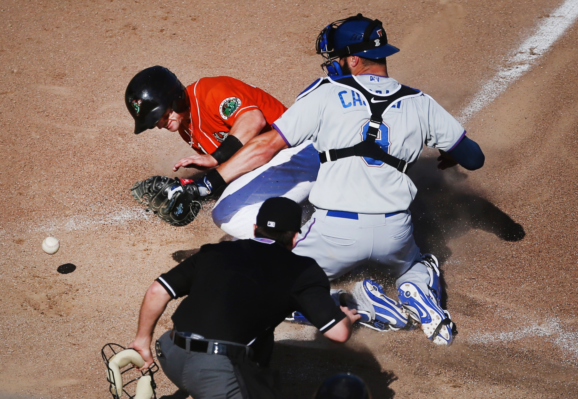 Norfolk's Johnny Giavotella scores the winning run on a 4-3 12th inning walk off double by teammate Mike Yastrzemski as Durham catcher Curt Casali can't corral the the ball, Sunday, May 7, 2017 at Harbor Park in Norfolk.