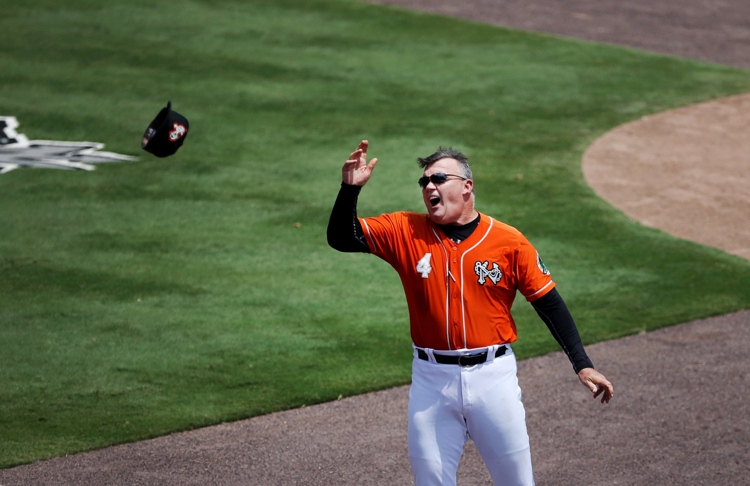 Tides manager Ron Johnson throws his hat into the stands after being ejected in his team's 2-1 win over Scranton/Wilkes-Barre, Thursday, July 26, 2017 at Harbor Park in Norfolk. 