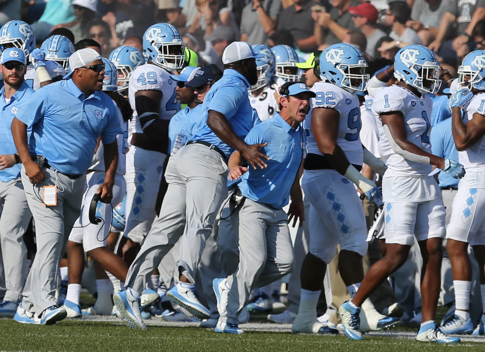 The UNC sideline erupts after the Tarheels forced an Old Dominion fumble in the second half of an NCAA college football game, Saturday, Sept. 16, 2017 in Norfolk, Va.