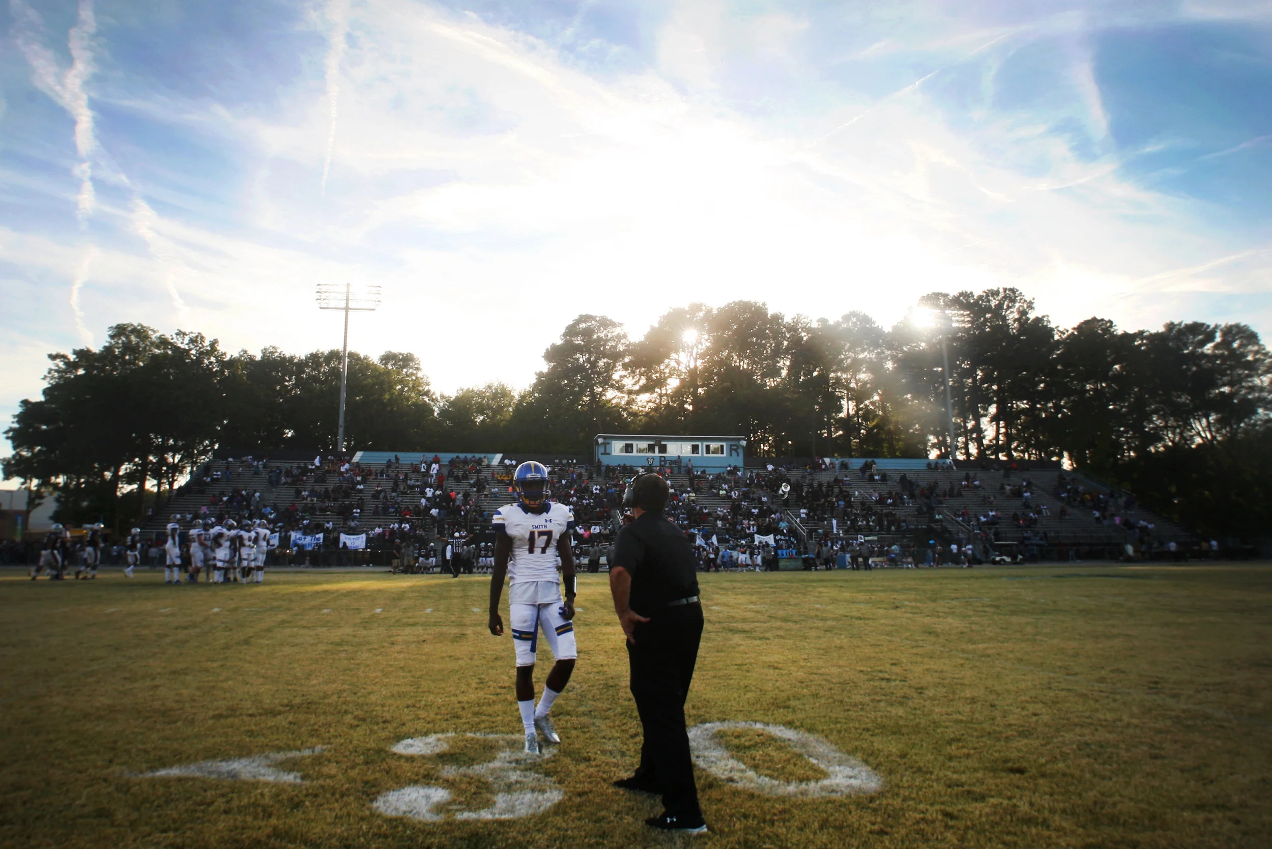 Oscar Smith head coach Scott Johnson and Dominique Brooks talk it over during the Tigers' 35-14 win against Indian River, Saturday, Oct. 21, 2017 at Indian River High School in Chesapeake. 