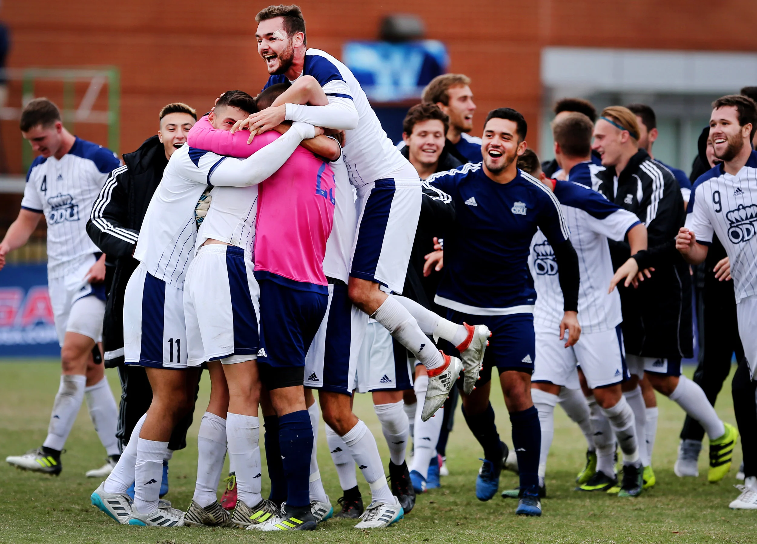 Old Dominion teammates celebrate their 1-0 win over Charlotte to claim the C-USA soccer championship, Sunday, Nov. 12, 2017 in Norfolk. 