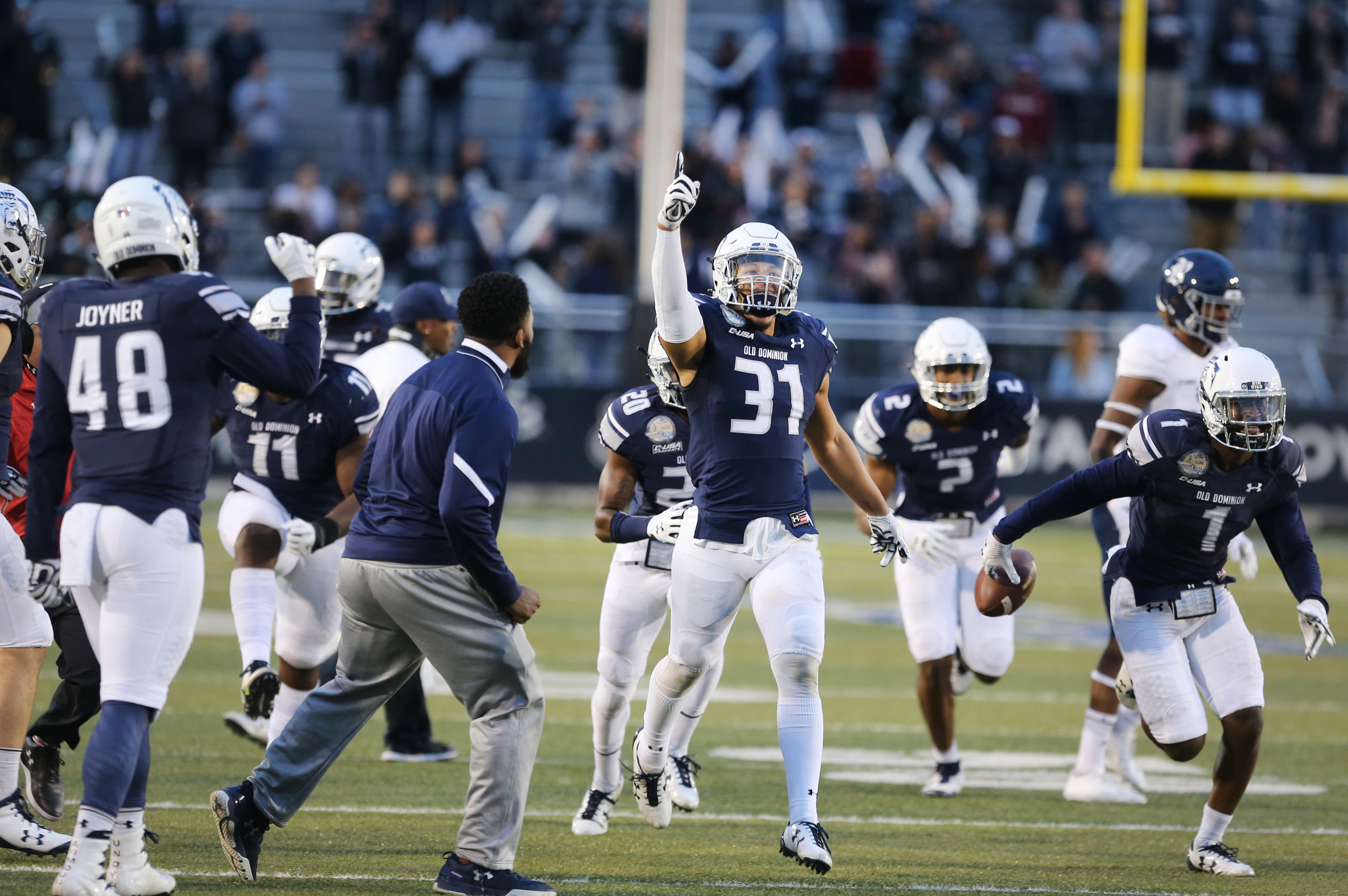 Old Dominion's Sean Carter, center, celebrates after intercepting a pass intended for a Rice receiver to seal ODU's 24-21 win over Rice in the closing seconds of the fourth quarter, Saturday, Nov. 18, 2017 at Foreman Field in Norfolk.