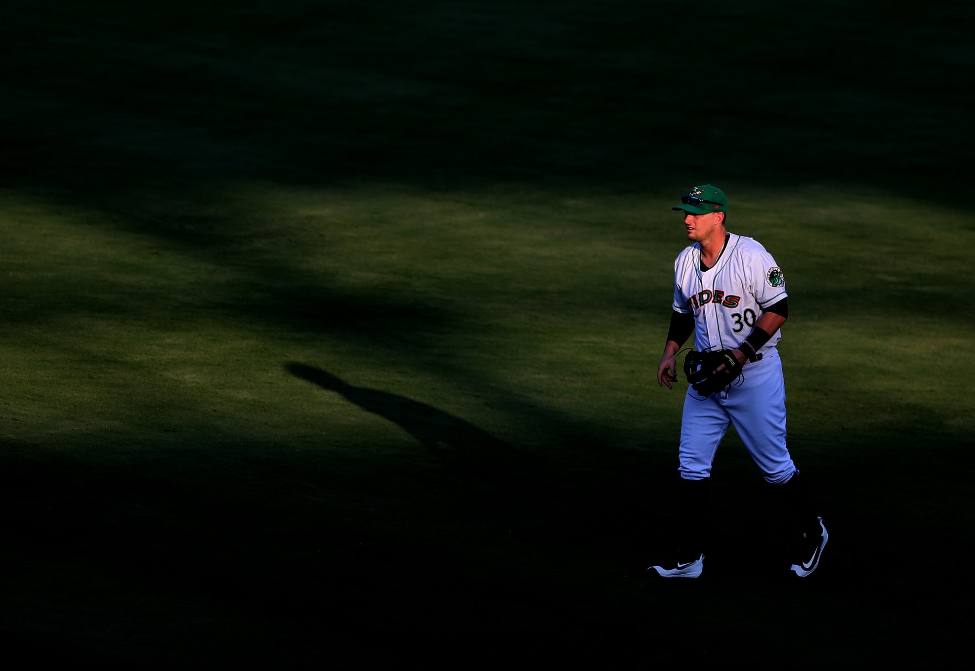 Tides second baseman Chris Johnson stands in short right field while playing the shift defense against Scranton's Jake Cave.