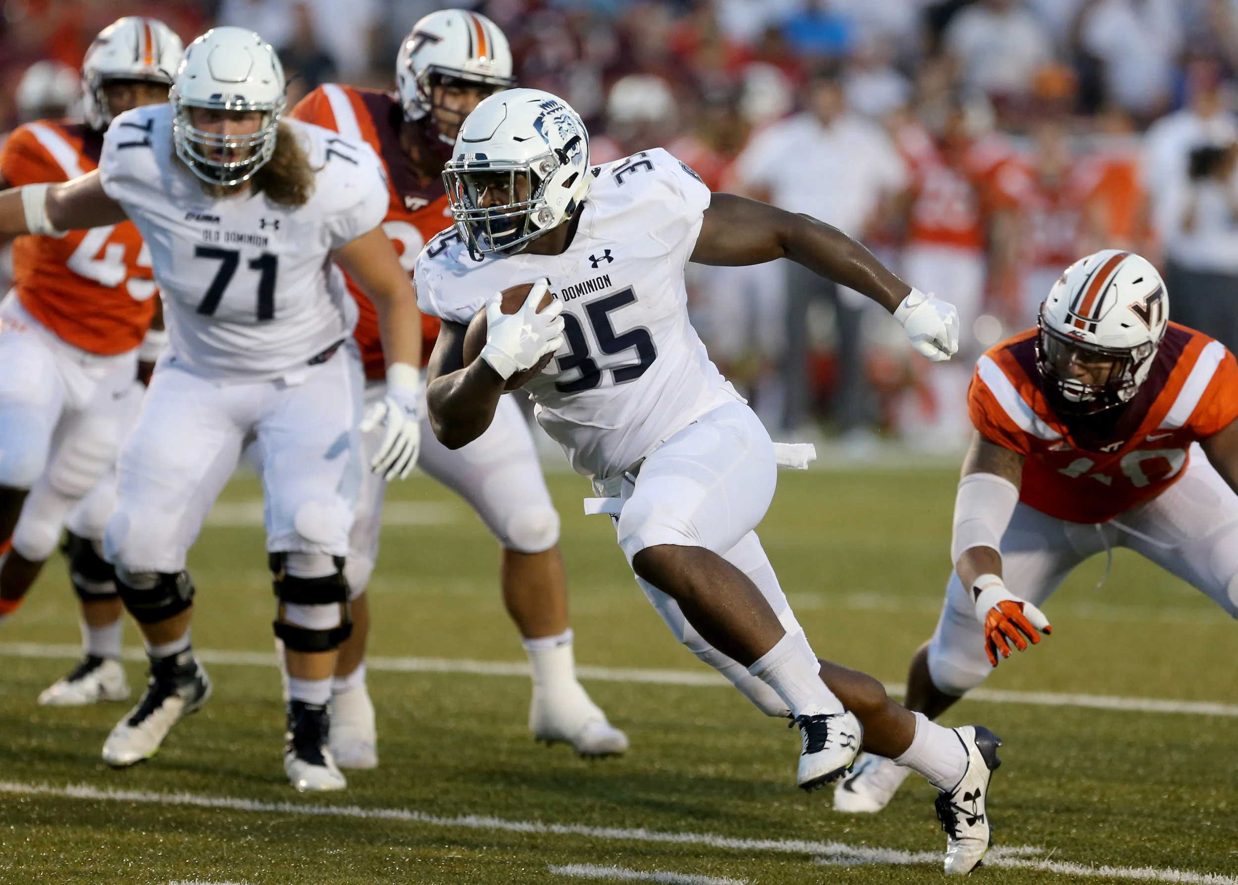 Old Dominion's Jeremy Cox runs for a first down against Virginia Tech during the second half of an NCAA college football game Saturday, Sept. 22, 2018, in Norfolk, Va. Old Dominion won 49-35. (AP Photo/Jason Hirschfeld)