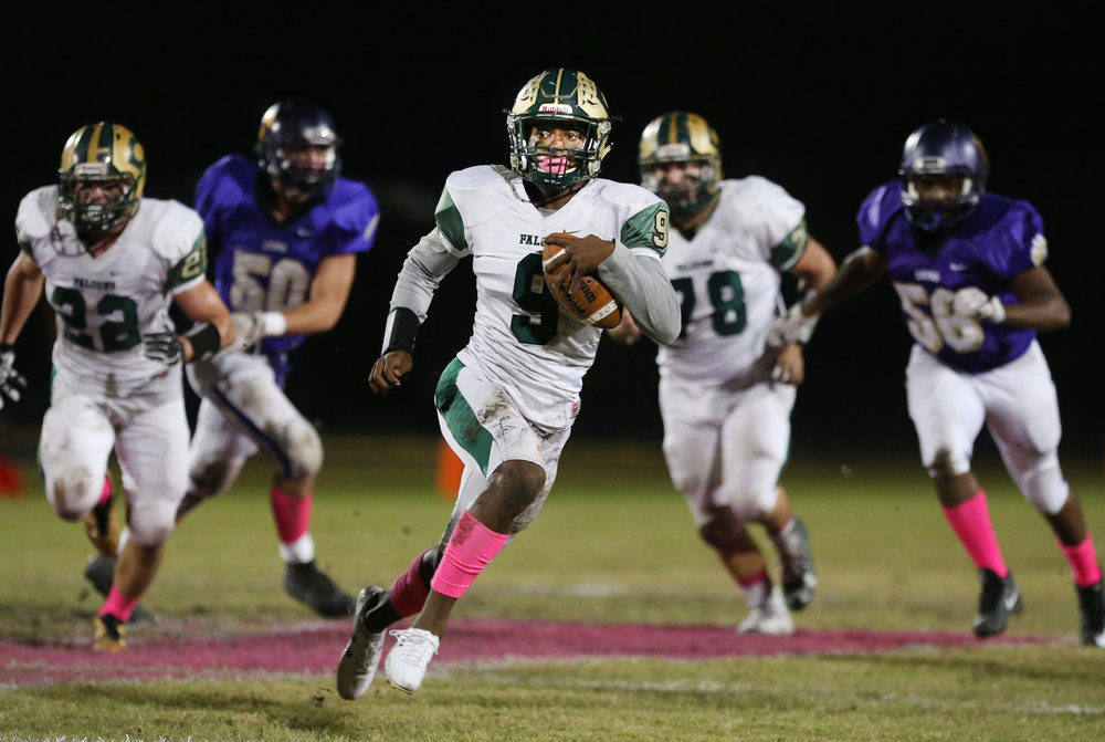 Cox's Tayvion Robinson finds yardage in the backfield during the Falcons' 28-24 loss to Tallwood.