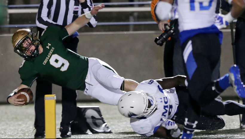 Bishop Sullivan's Jake Low appears to cross the plane but was ruled out of bounds during their 16-6 loss to nationally ranked IMG Academy in Virginia Beach.