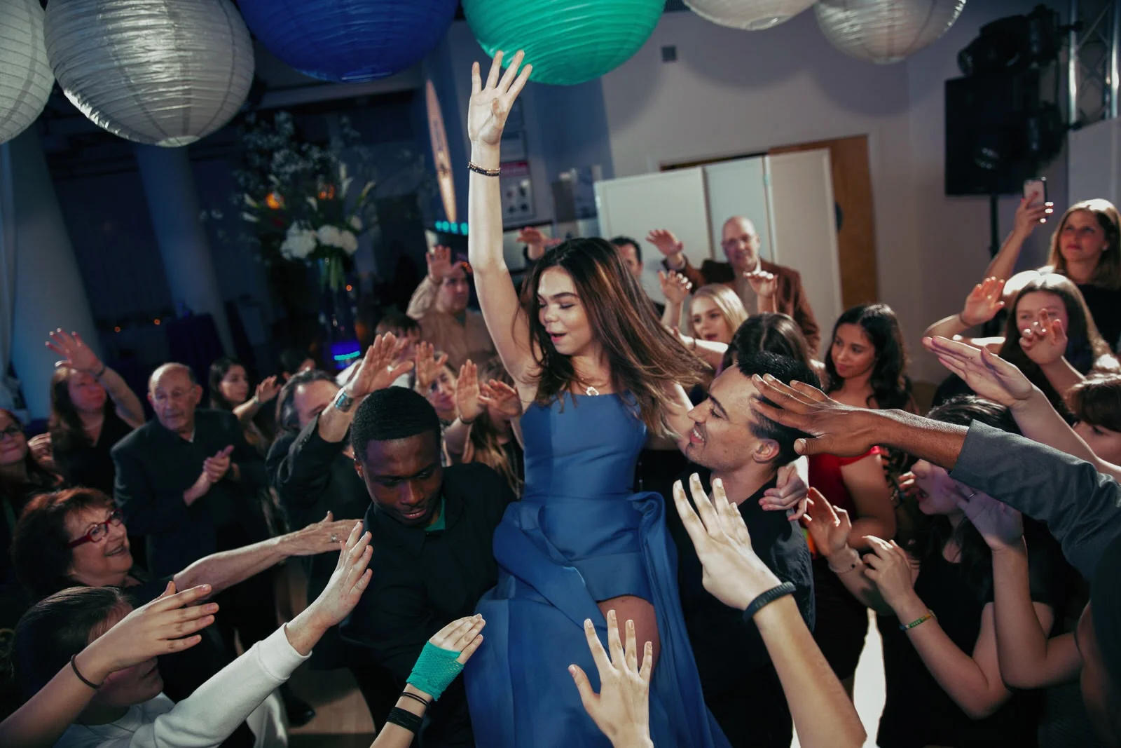 Gracie on the dance floor, surrounded by friends and family. Photo by Art Photographers.