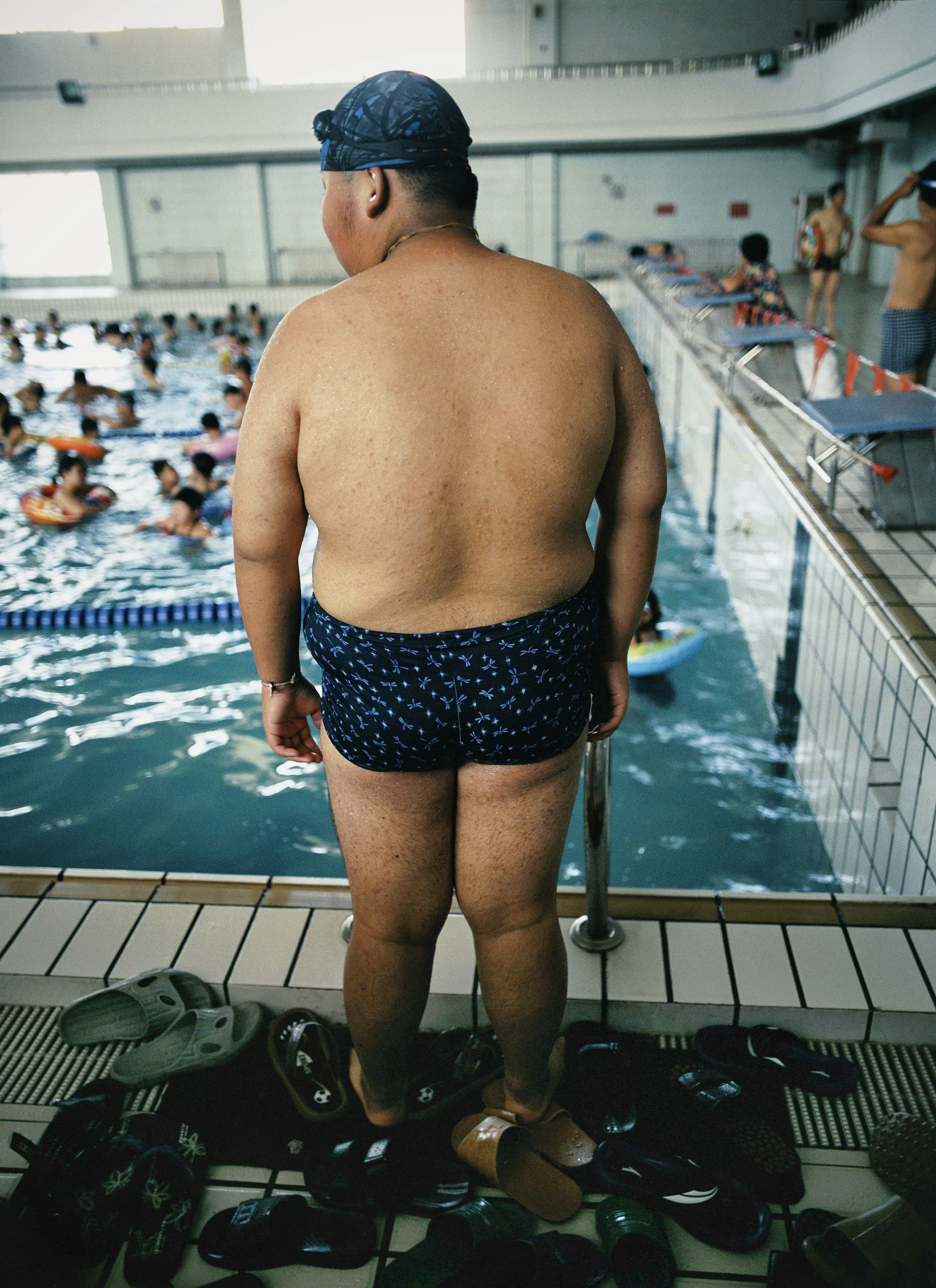  Tianjin, 2004.  Li Xiang, 14, gets ready swim at Aimin Fat Reduction Hospital.  He weighed 290 pounds when he arrived at the center; in six weeks he was down to 240     