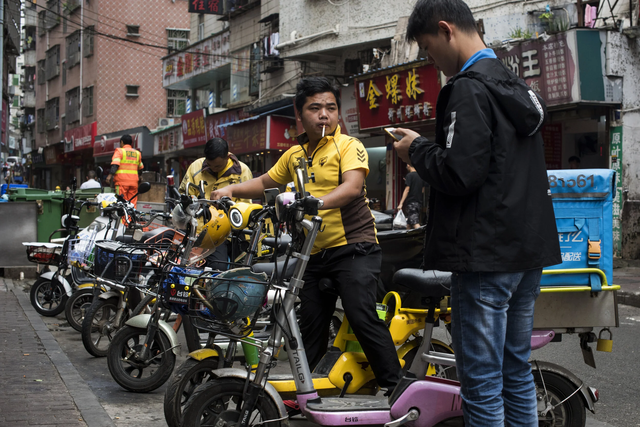  Shenzhen, 2019.  The rapid rise of ordering meals and products on the internet has led to a huge growth in door-to-door delivery services such as SF Express, and Meituan.   Riding motorbikes for these services have become the dominant entry level jo