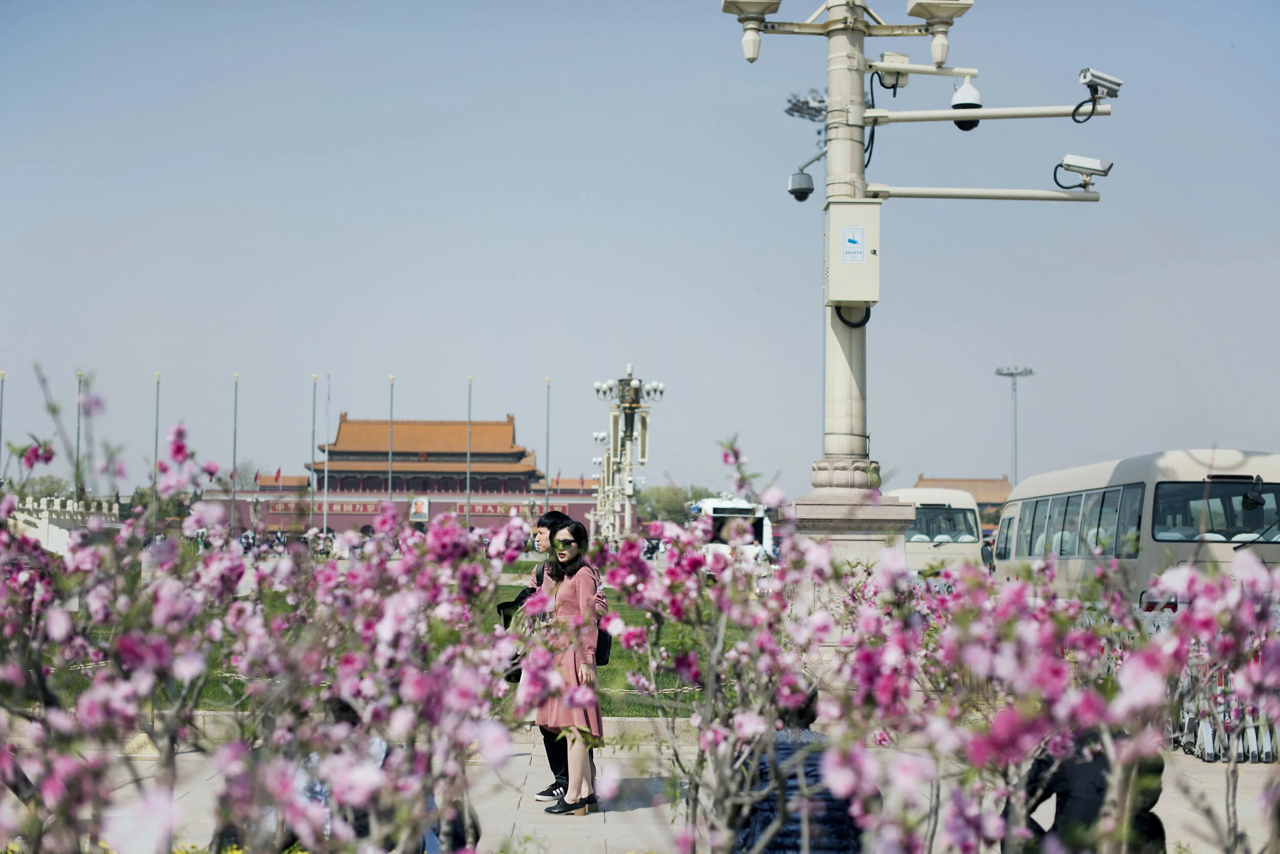  Beijing, 2019.  Young couple spends part of the weekend visiting Tiananmen Square.  Like all visitors, their every move is recorded from multiple angles by the surveillance cameras that festoon many of the lampposts. 