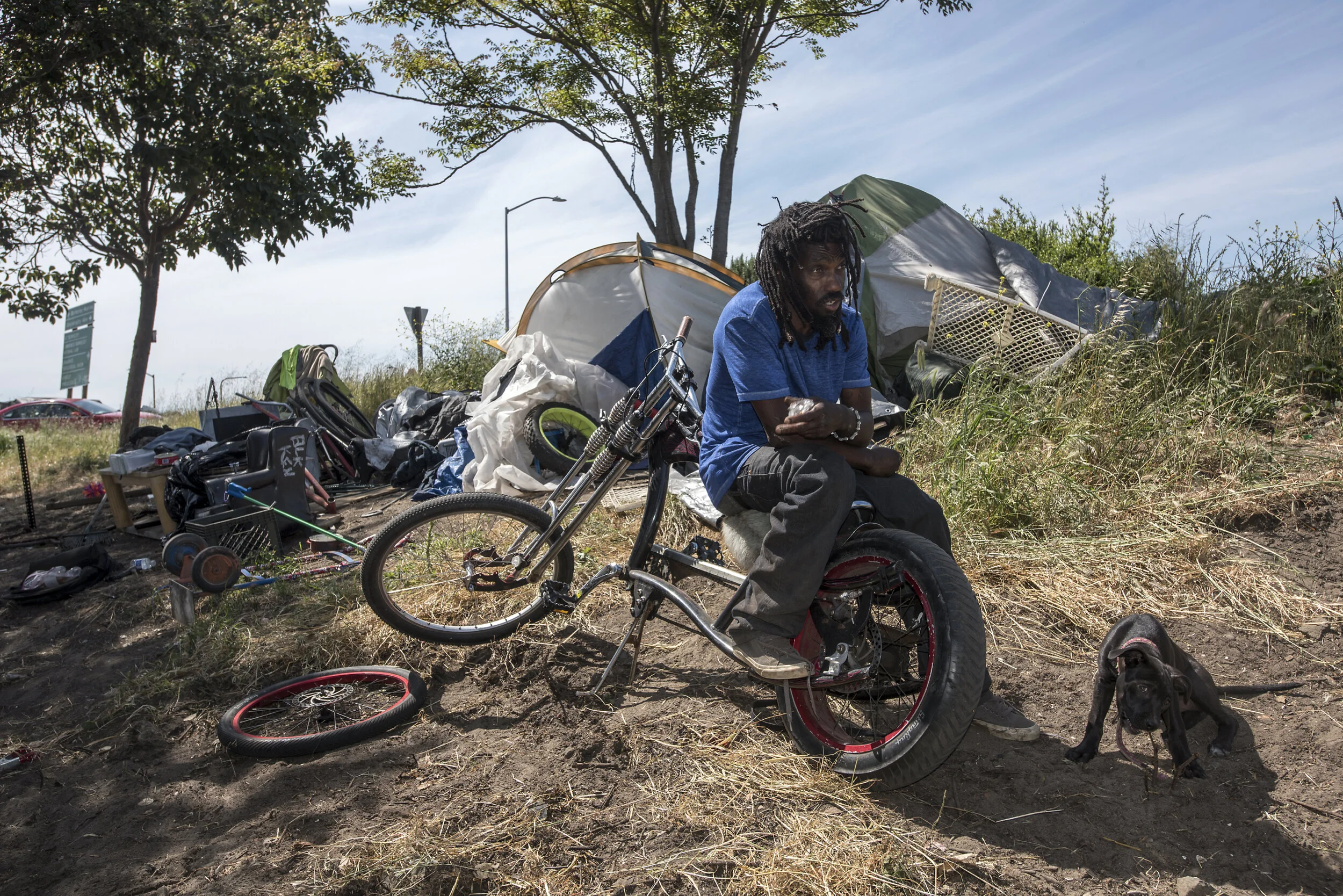  K currently lives with his puppy Z near the University Street freeway exit in Berkeley.  He is originally from Oakland and has been unhoused 5 years.  Of the homeless he says, “We are all black as far as they are concerned.”  He believes the pandemi
