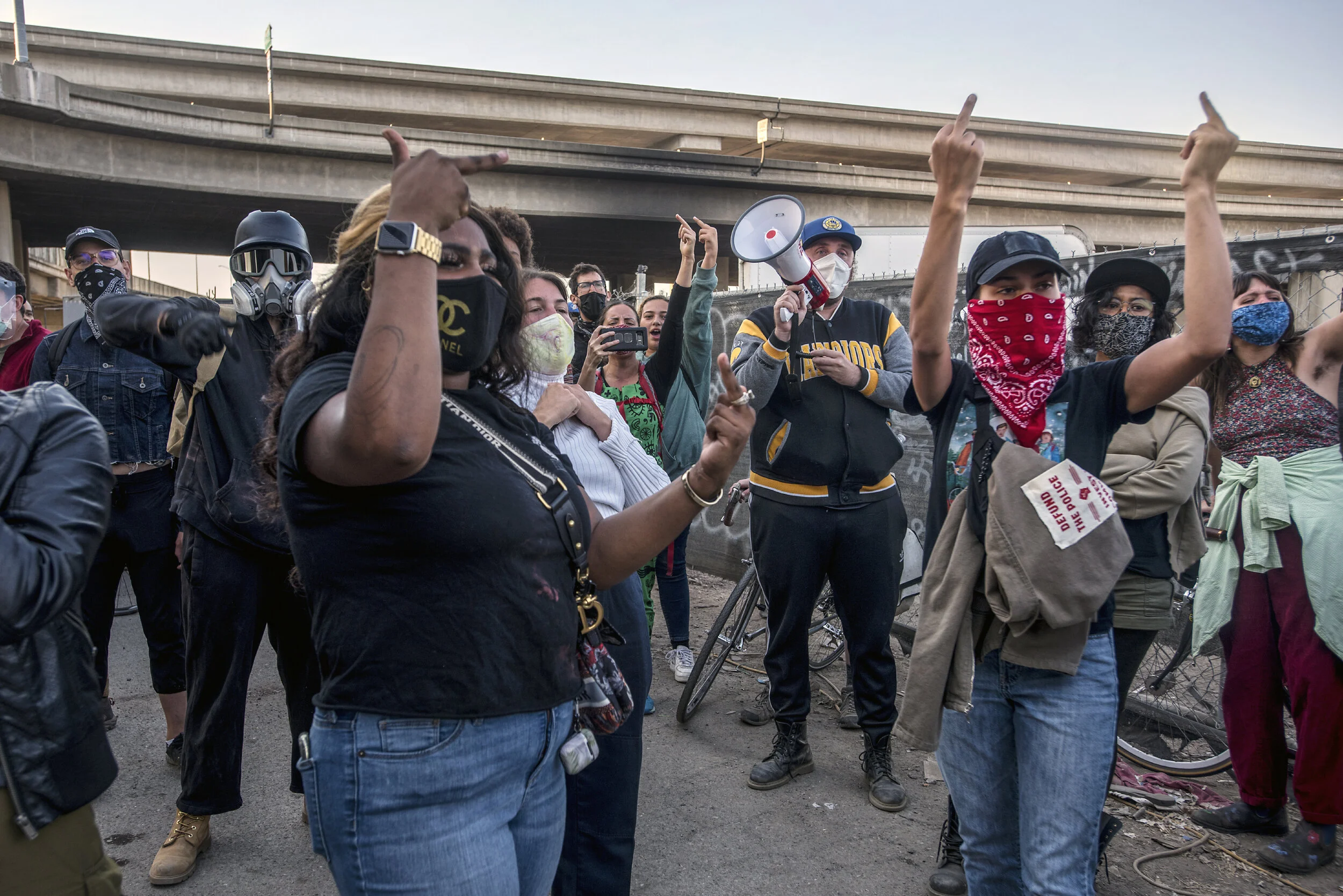  Members of the United Front Against Displacement and others —housed and unhoused — protest against the Alameda County Sheriff department’s action to evict some homeless dwellings on a piece of land owned by a investment company. 