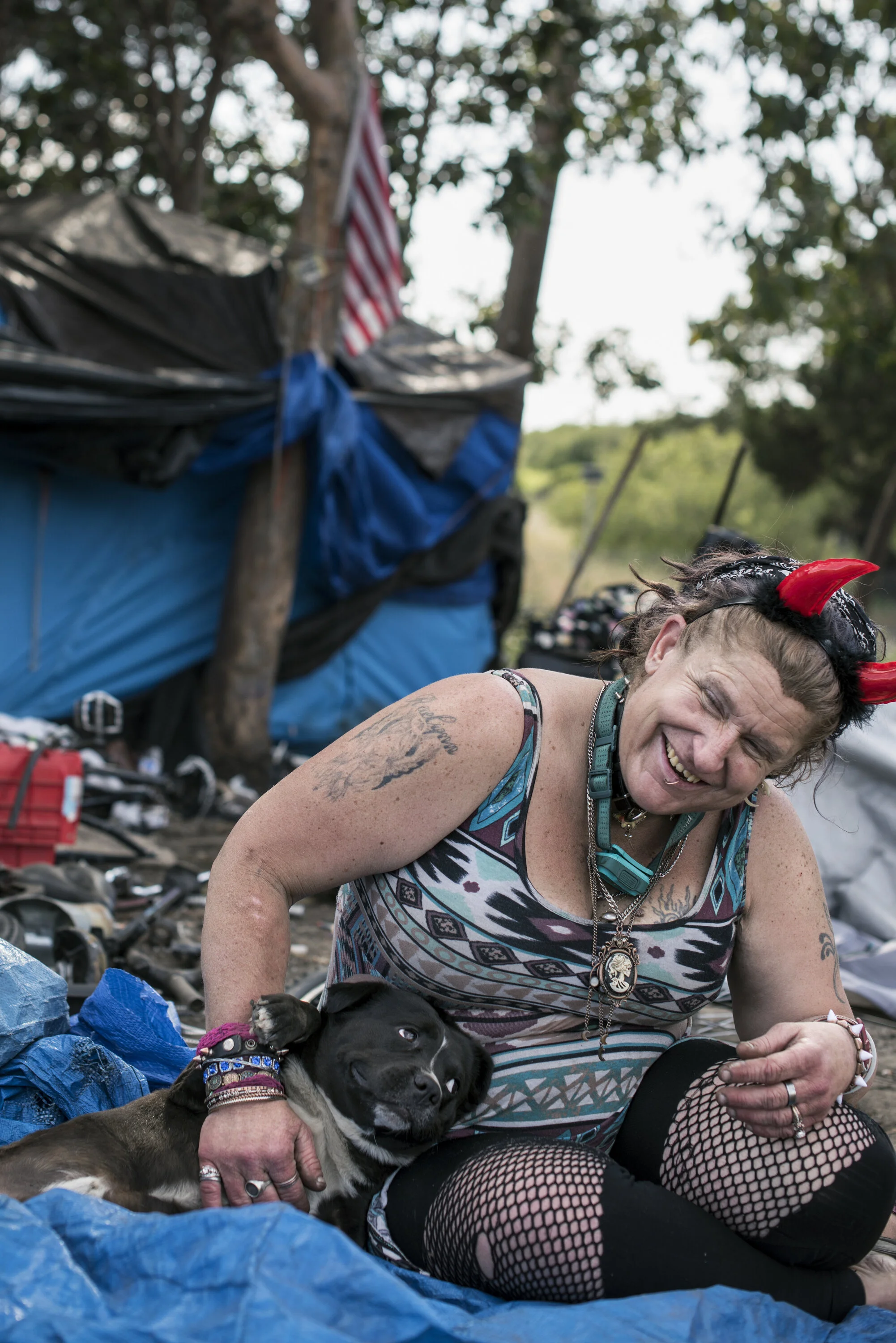  Berkeley, California, USA.  Unhoused woman and her dog 