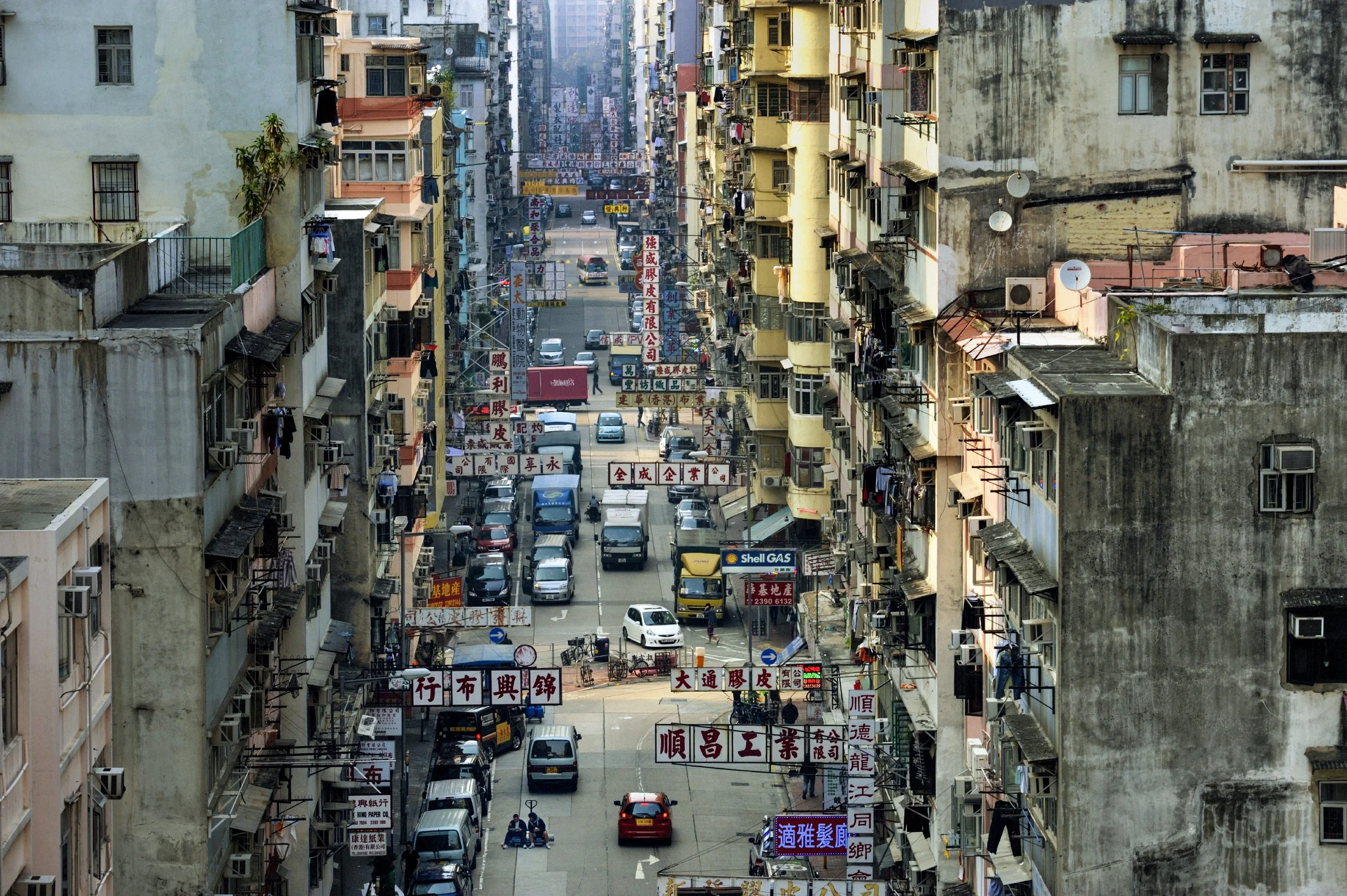  Hong Kong.  Sham Shui Po is one of the oldest neighborhoods in the territory, with small businesses on the ground floors and low income apartments above (for  National Geographic ) 