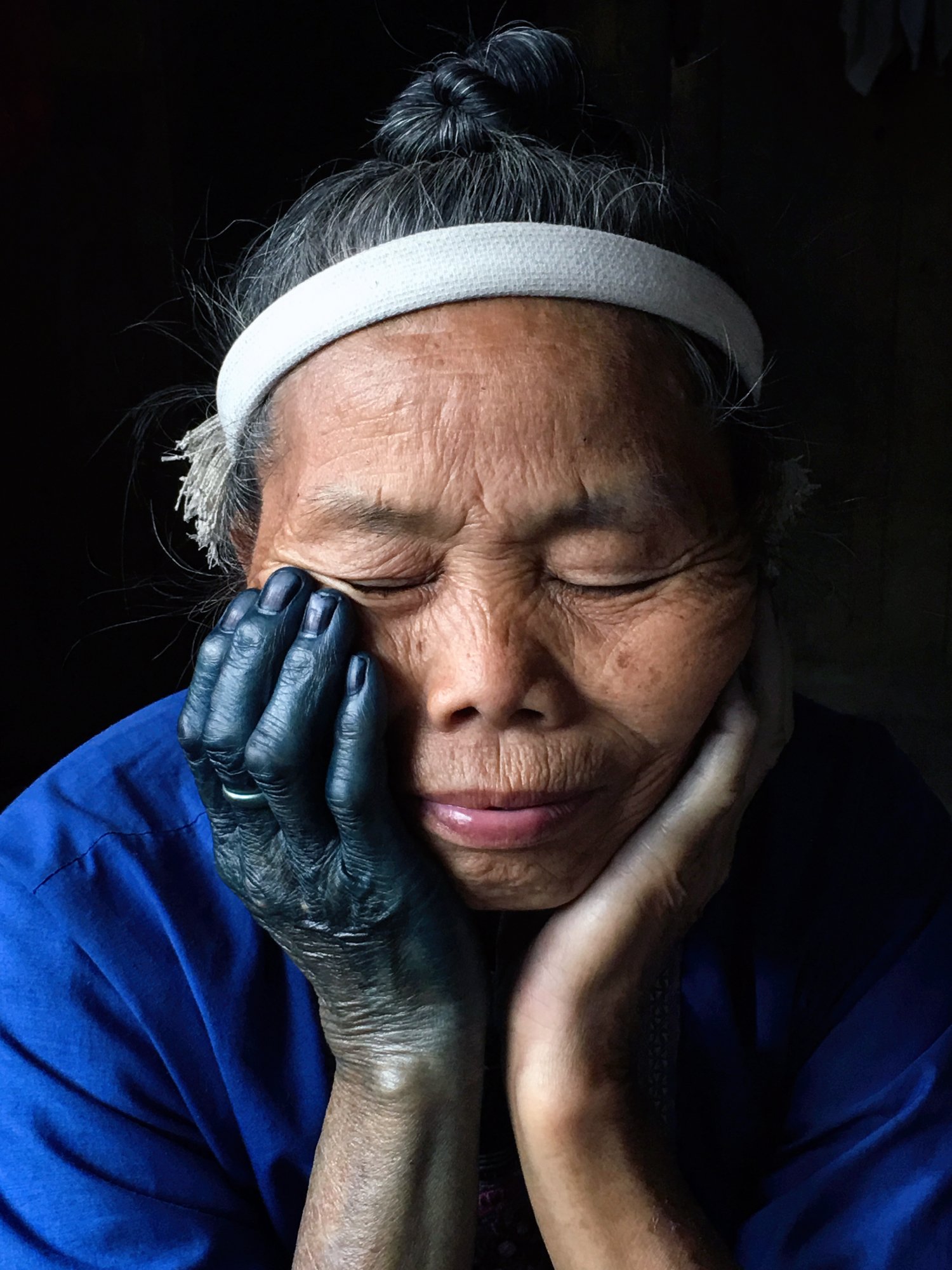  National Geographic.  Dong minority woman's hand is dyed blue from soaking traditional cloth in vats of indigo.  Guangxi, China 