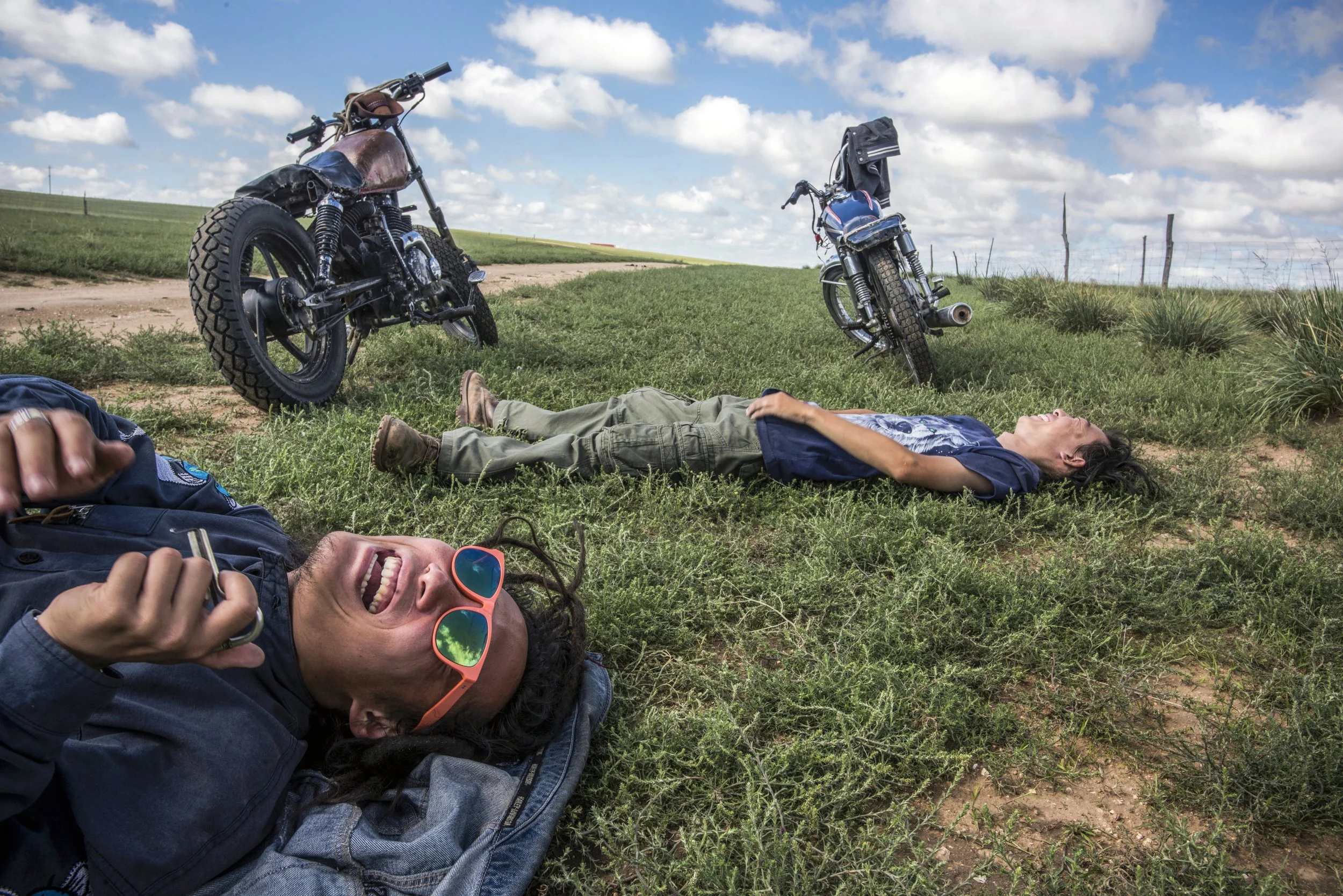  National Geographic.  Urban refugees Da Fei and Lao Dai roam the grasslands on their motorcycles.  Inner Mongolia, China 