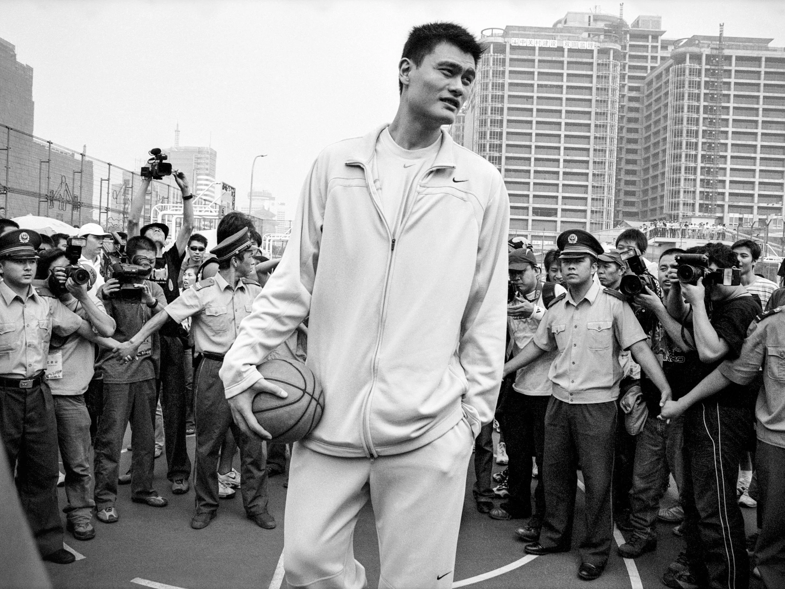  Beijing, China.  Basketball star Yao Ming makes a surprise visit to a local playground 