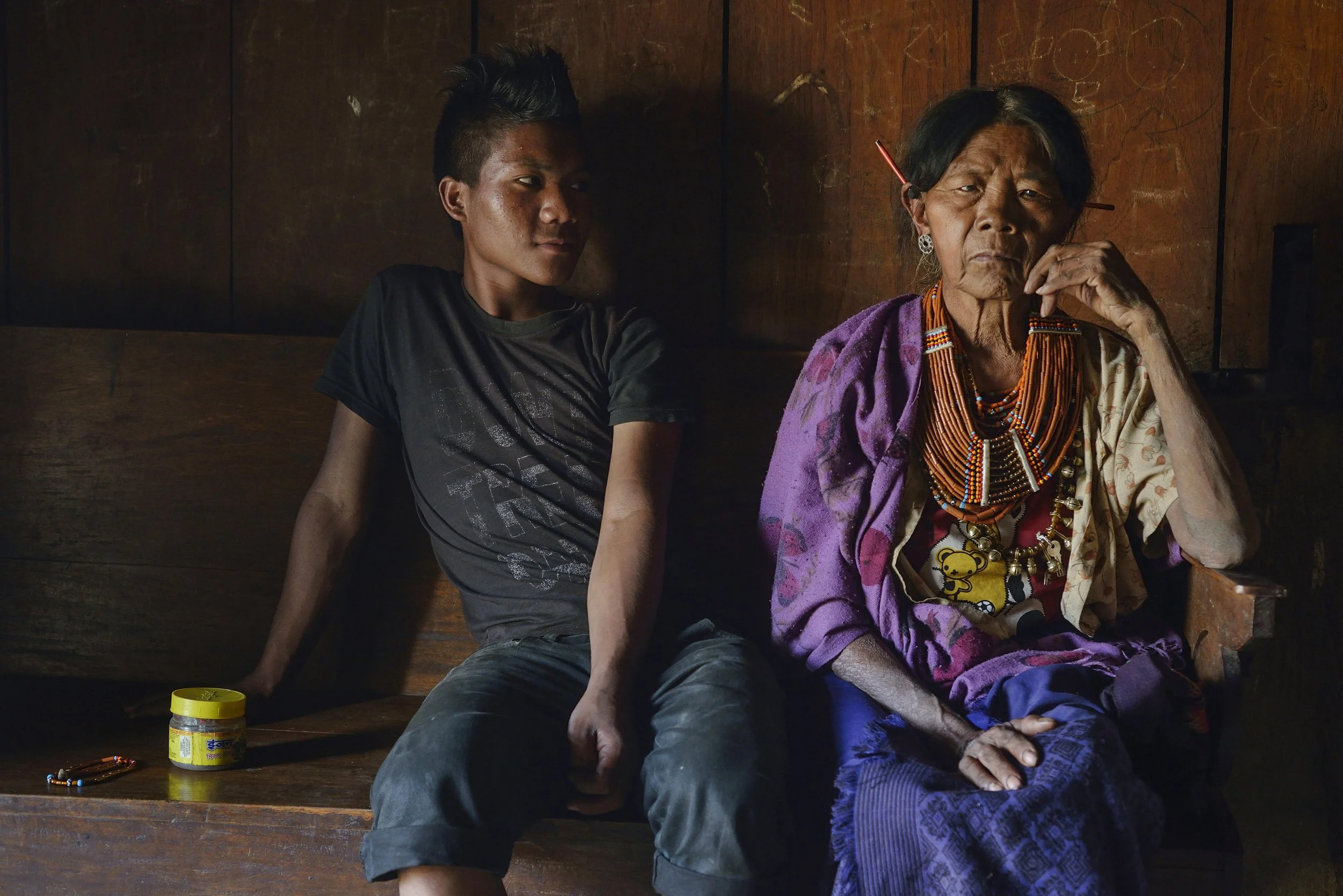  National Geographic.  Konyak youth with his grandmother, once the wife of the village chief.  Nagaland, India 