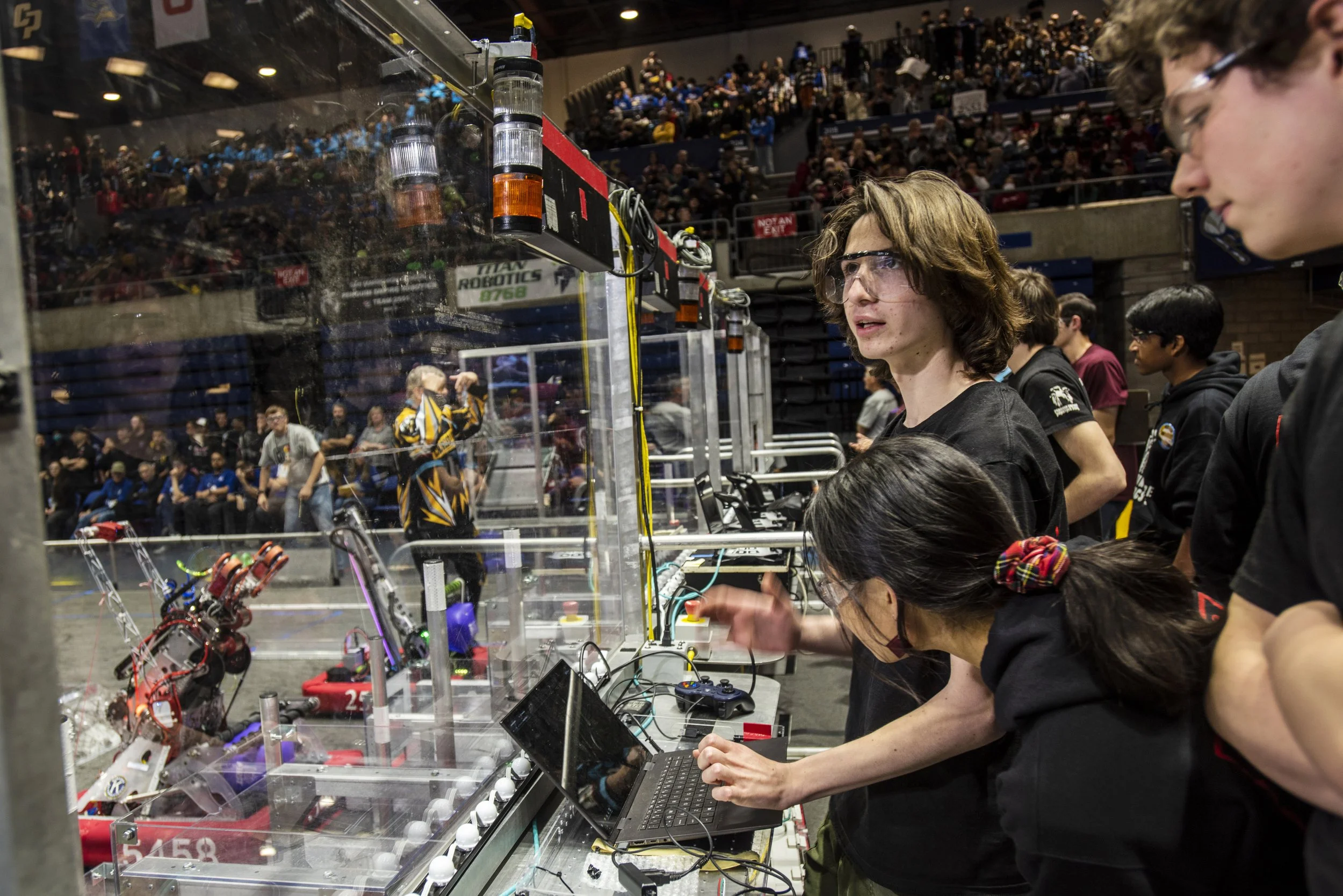  Bay Area High School STEM Competitors.  Davis, 2023. Berkeley High School Team 5419 Berkelium’s drive and programming crew calibrate the targeting camera on their robot before a playoff match 