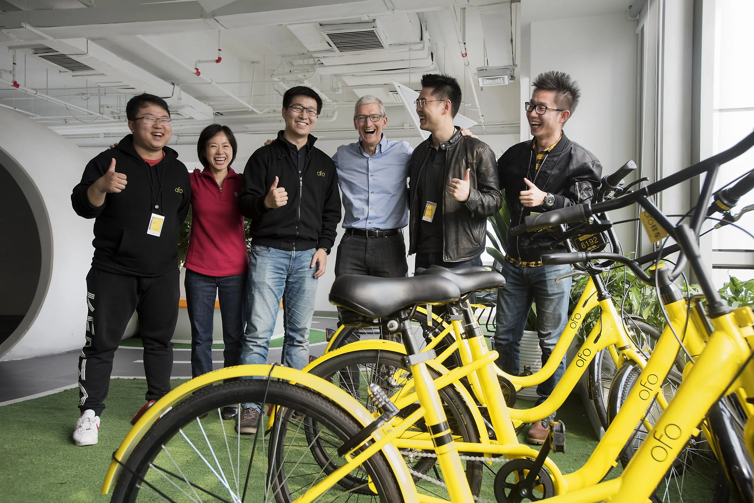  Beijing, China. Apple CEO Tim Cook visit to ofo bicycle ridehsare app developer 