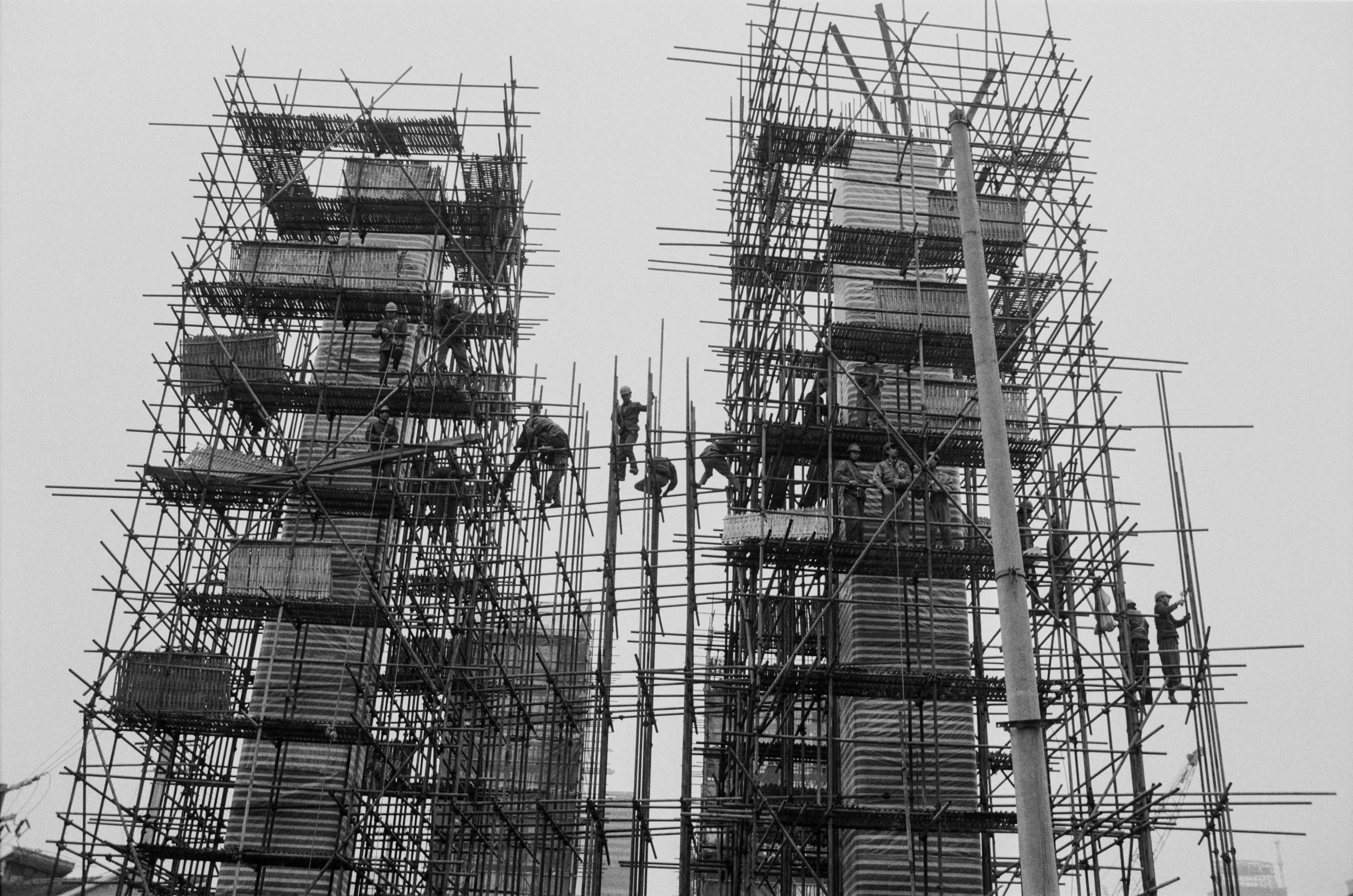  Shanghai, 1997.  Workers construct pilings for an elevated highway. 