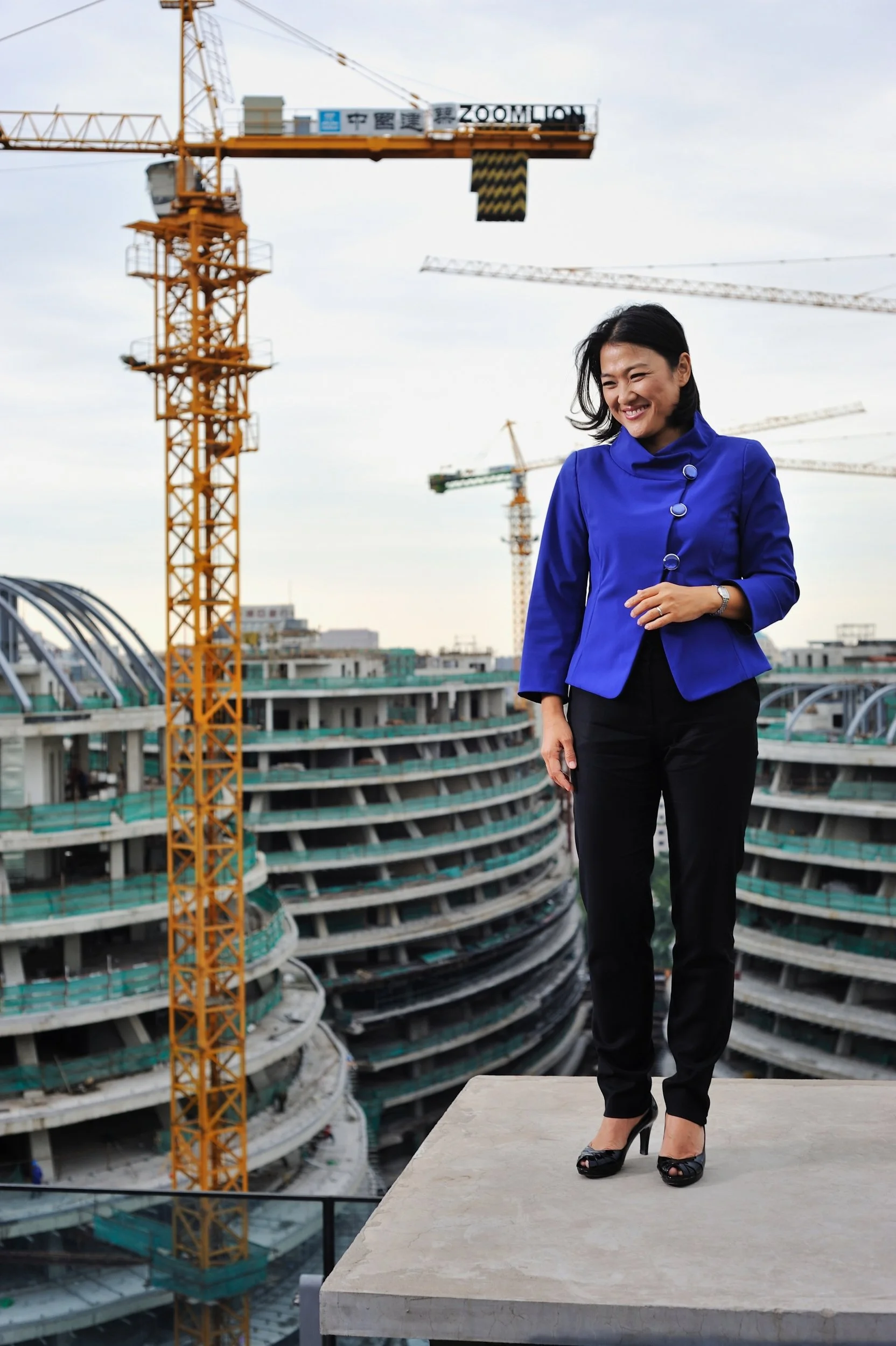  Beijing, 2011.   SOHO China real estate CEO Zhang Xin on the construction site of the company’s Zaha Hadid-designed Galaxy SOHO development 