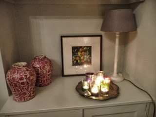 These tea light holders below are actually Moroccan glasses for drinking tea. They create much more of an effect when they are grouped together. I've grouped them on a vintage pewter plate