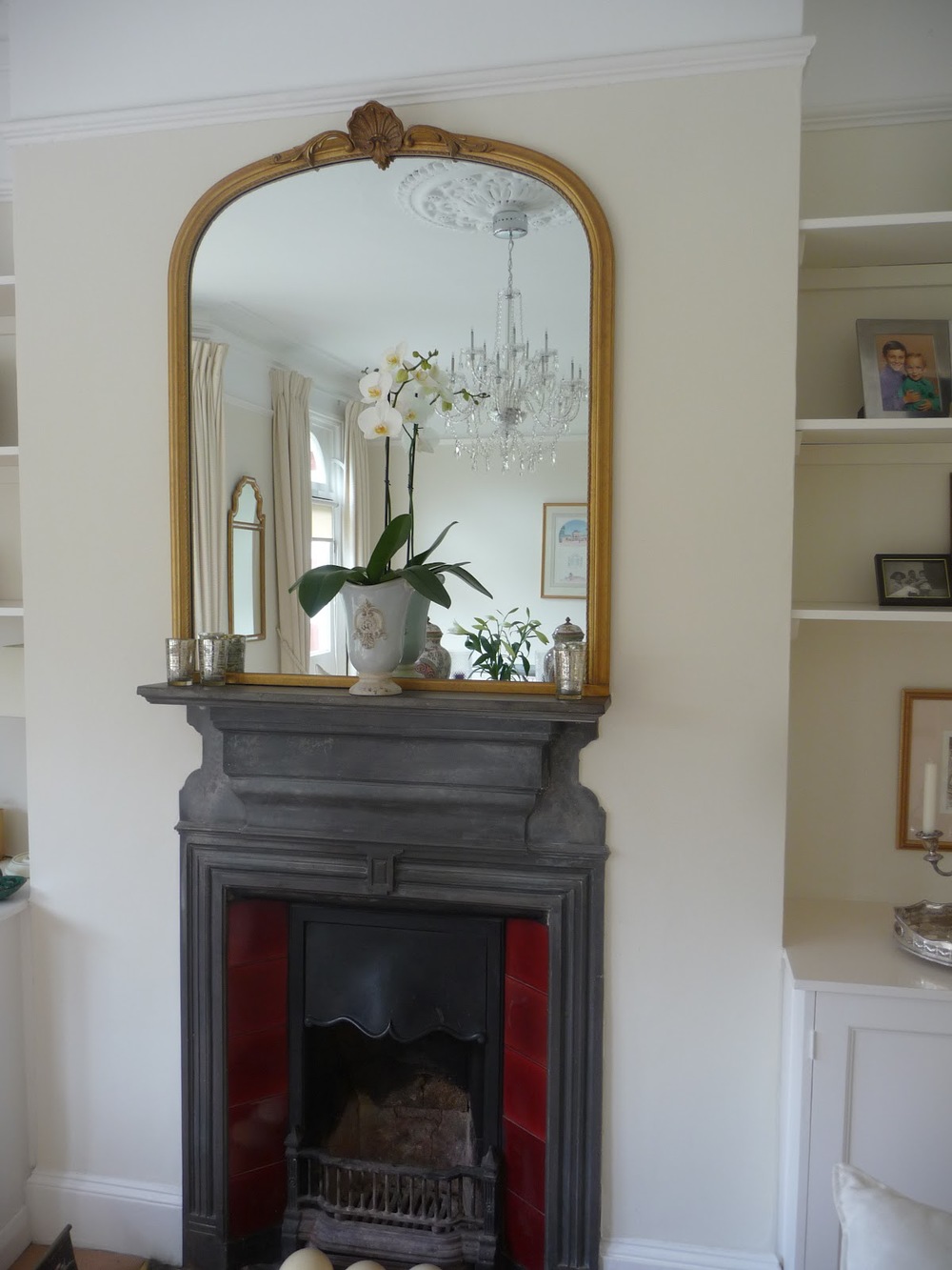 A large mirror over a fireplace always works. I chose this one as it fitted between the fireplace and the picture rail, maximising the space.