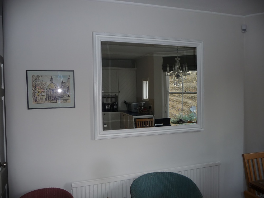 This is a very large pine mirror in my kitchen that serves the purpose of creating light. It's not a feature mirror as it has no redeeming features so I've painted it the same colour as the wall. I would recommend that when you buy mirrors, you buy for their features rather than practicality.