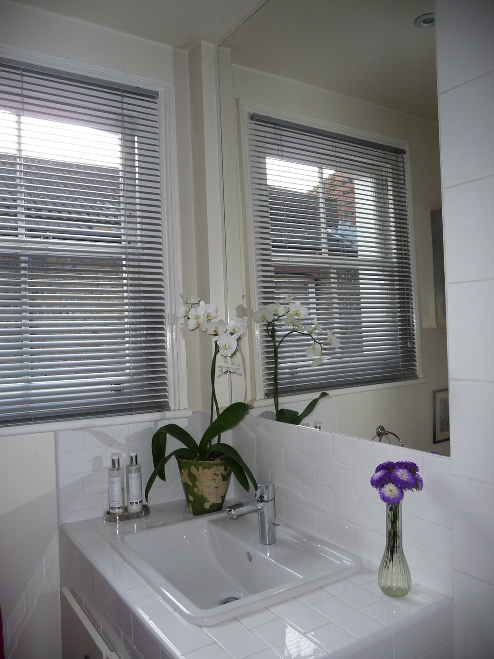 The bathroom mirror. Like most London flats, my bathroom is not large so I added a large piece of mirror, cut to size, above the sink right up to the ceiling. It makes the room seem so much larger and lighter. 