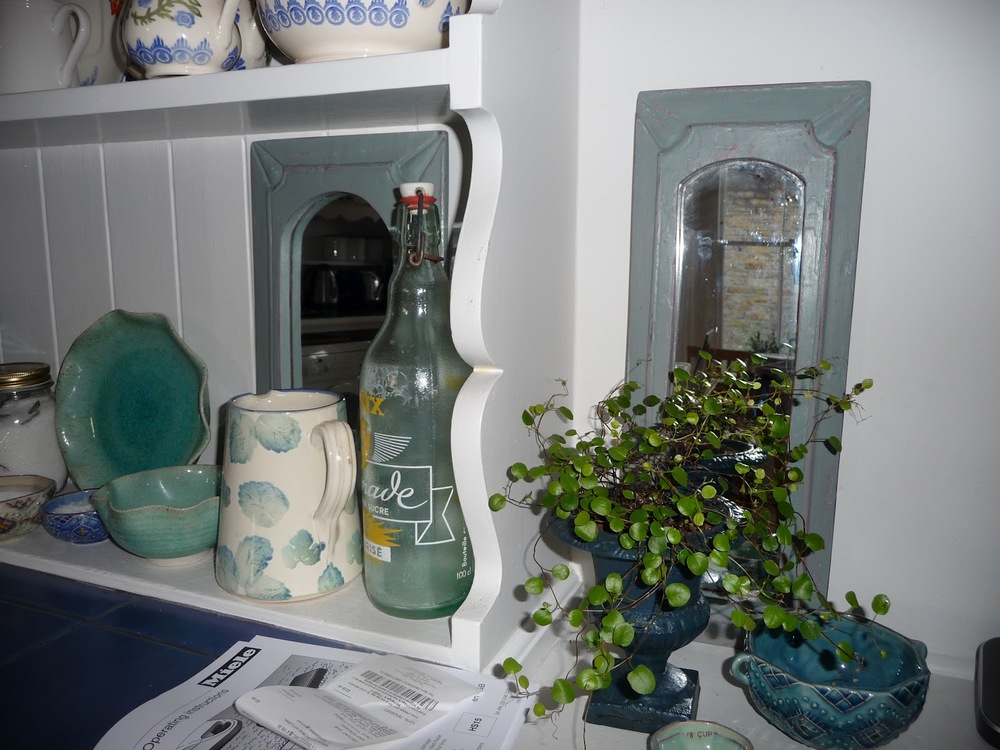 Two little mirrors from Quirky Dovetail in Balham which I repainted in two Annie Sloan colours - Scandinavian Pink and Duck Egg Blue. I use them on this shelf as decorative items. 