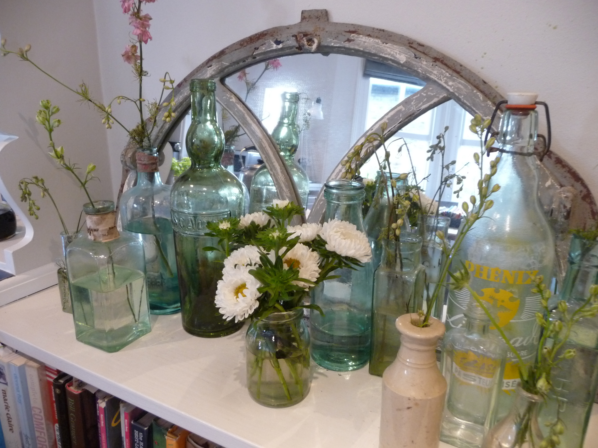  My vintage bottles with the offshoots of other flowers I've bought. The little jar of white Asters were the offshoots also 