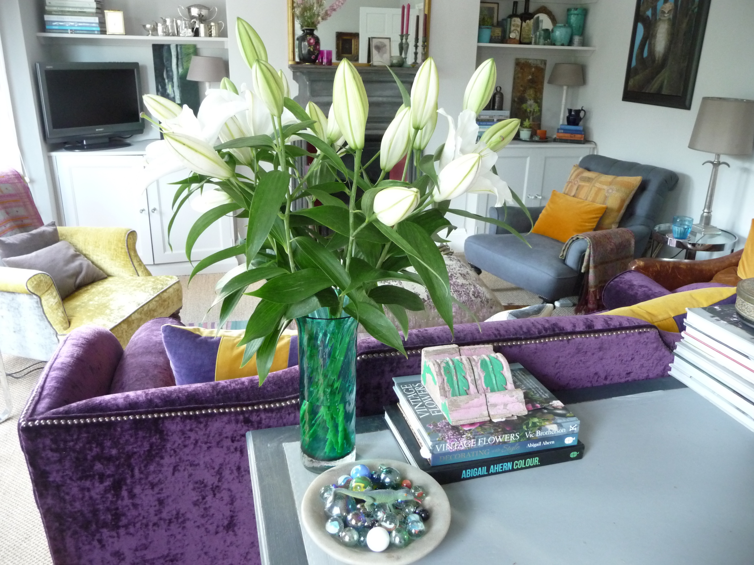  Glass vase of white lilies to add scent to the sitting room. Remember to remove the pollen from each flower as it opens or you could end up with horrible stains on your furniture or carpet. 