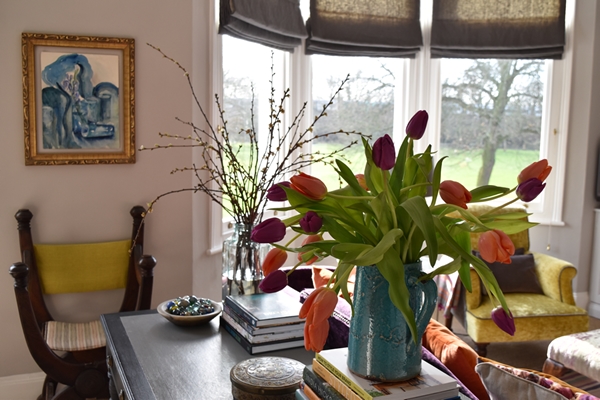  Here you can see vases of tulips and blossom in the sunlit sitting room.&nbsp; It's like bringing the outside in ! 