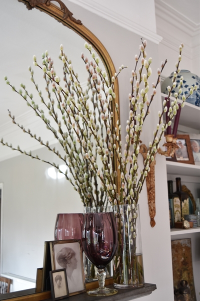  The pussy willow adds drama, texture and height to the mantlepiece 