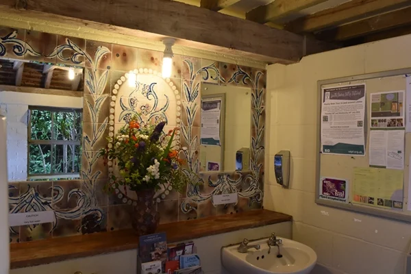 Even the ladies' bathroom is beautifully decorated with paint effects, handpainted tiles and flowers from the garden!