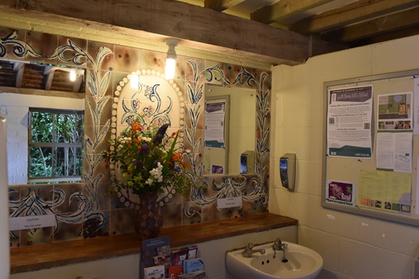  Even the ladies' bathroom is beautifully decorated with paint effects, handpainted tiles and flowers from the garden! 