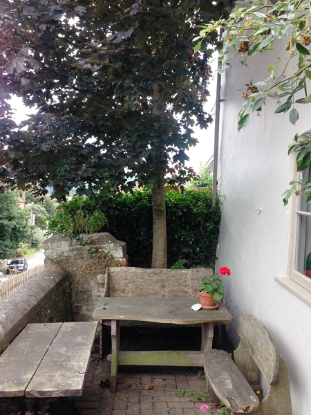 There are many intimate areas to sit which are quirky but beautiful. This tiny seating area is the only one at the front of the pub looking across the road to the church