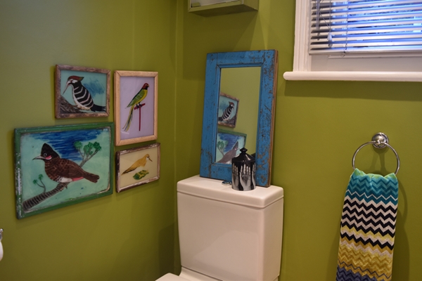 I've hung the four Indian bird paintings (painted on glass) at right angles to the turquoise framed Indian mirror.